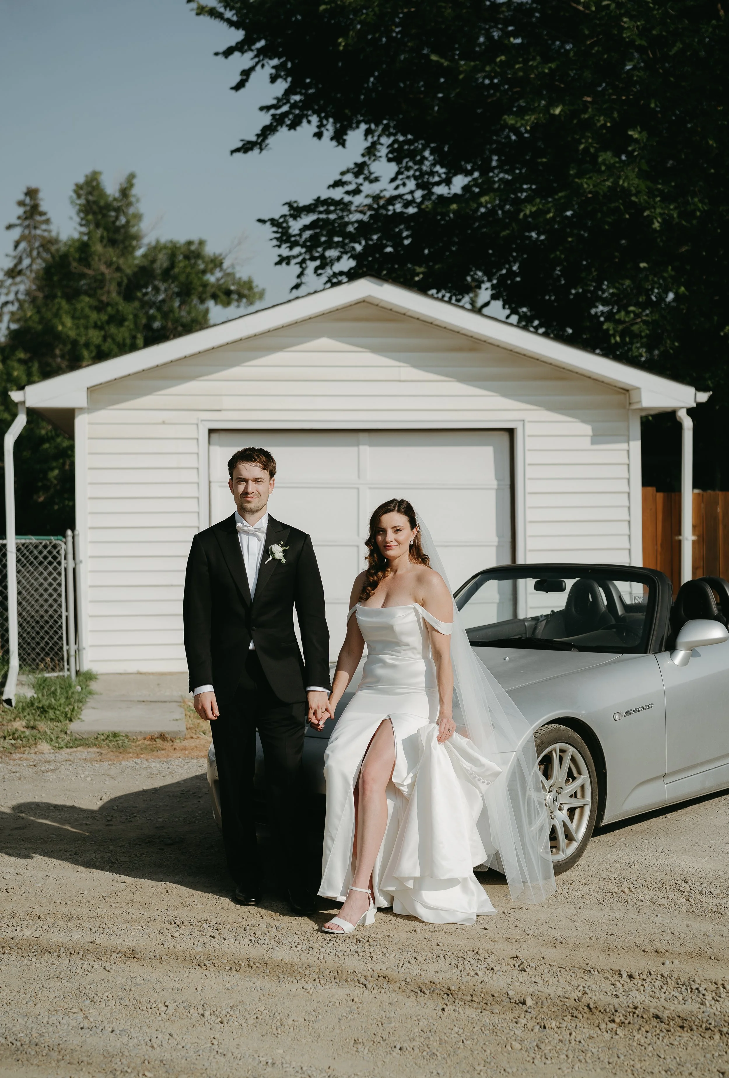 calgary, alberta wedding photographer.  bride and groom with car in photo for official portrait