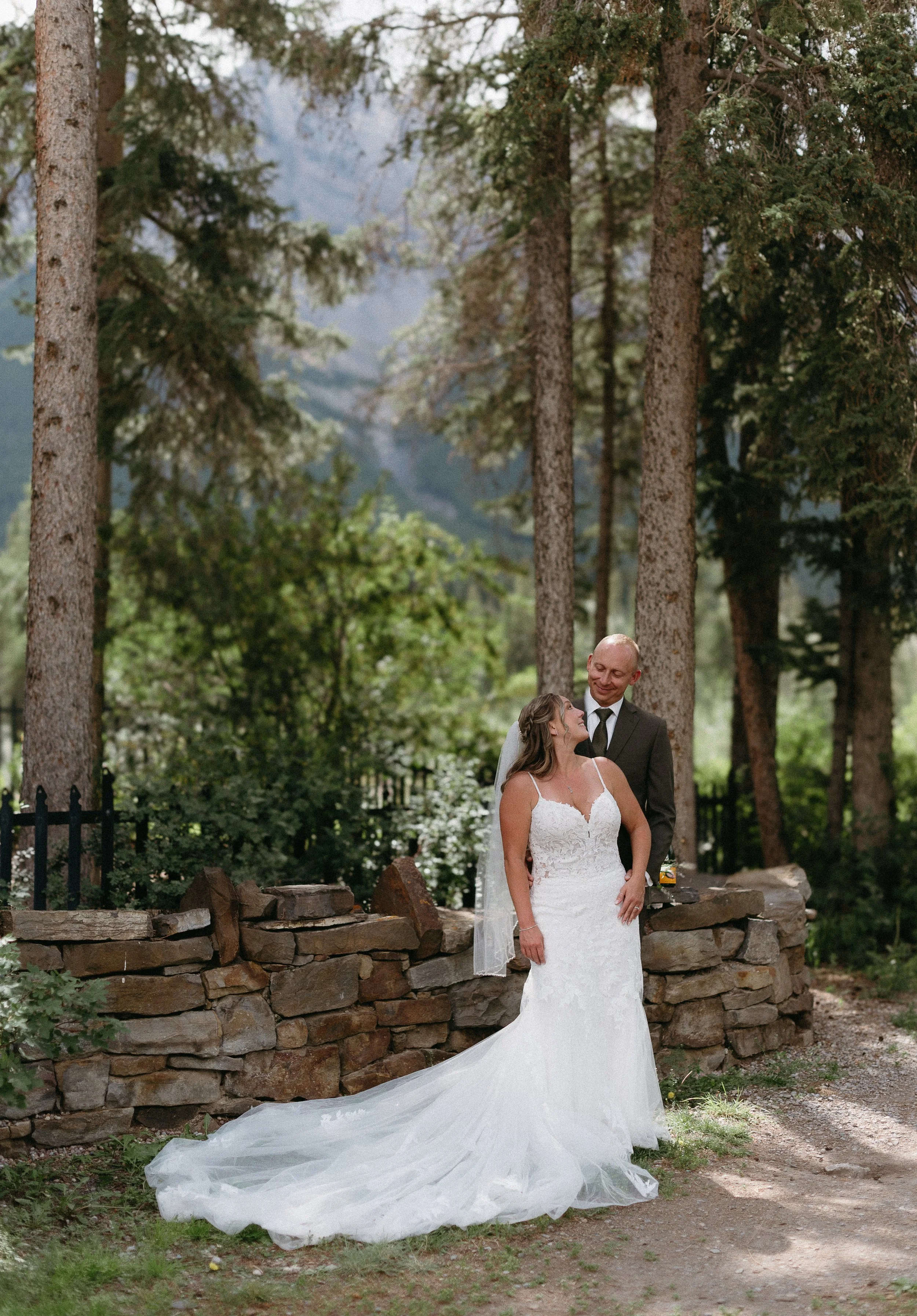 CANMORE WEDDING PHOTOGRAPHER. bride a groom near the river in Canmore, summer wedding in Canmore