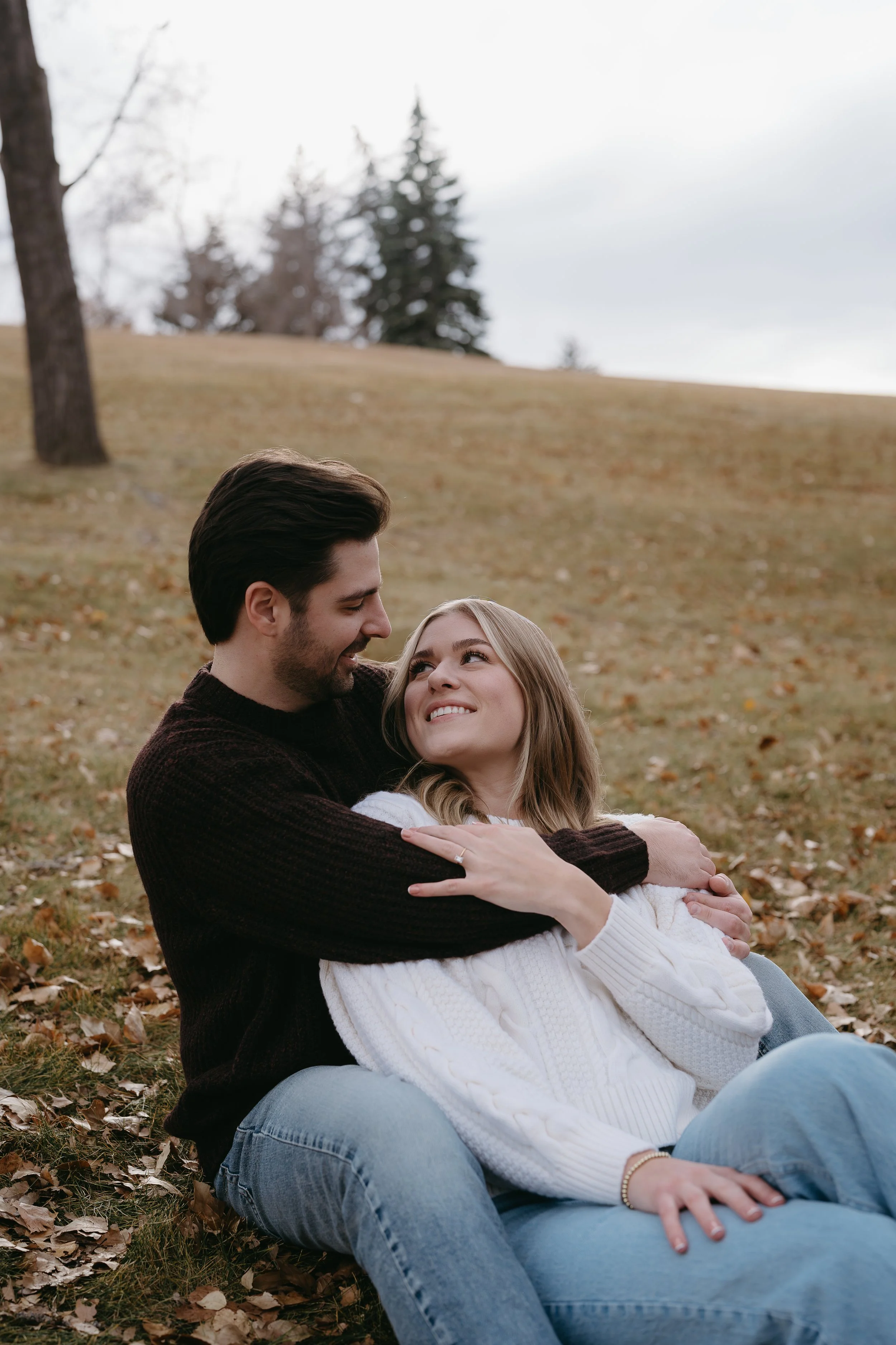Calgary, Alberta. Engagement Session of couple in Confederation Park, shot by KC Photography