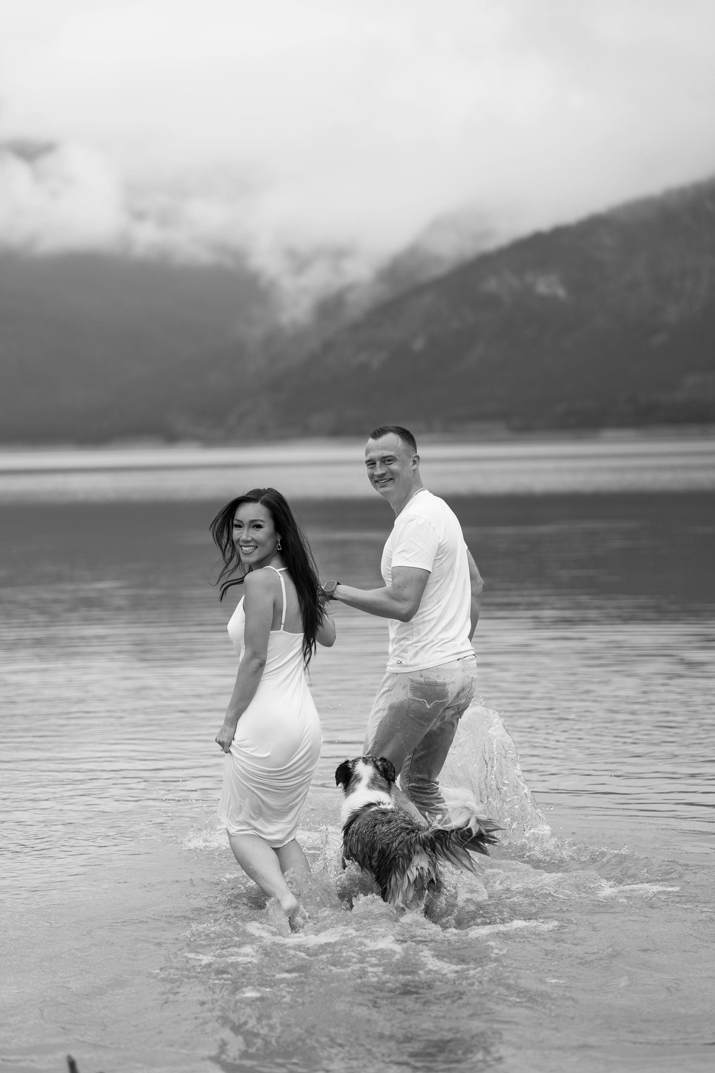 Kananaskis Wedding Photographer. Couple in white clothes in a mountain lake in Alberta near Banff, shot by KC Photography
