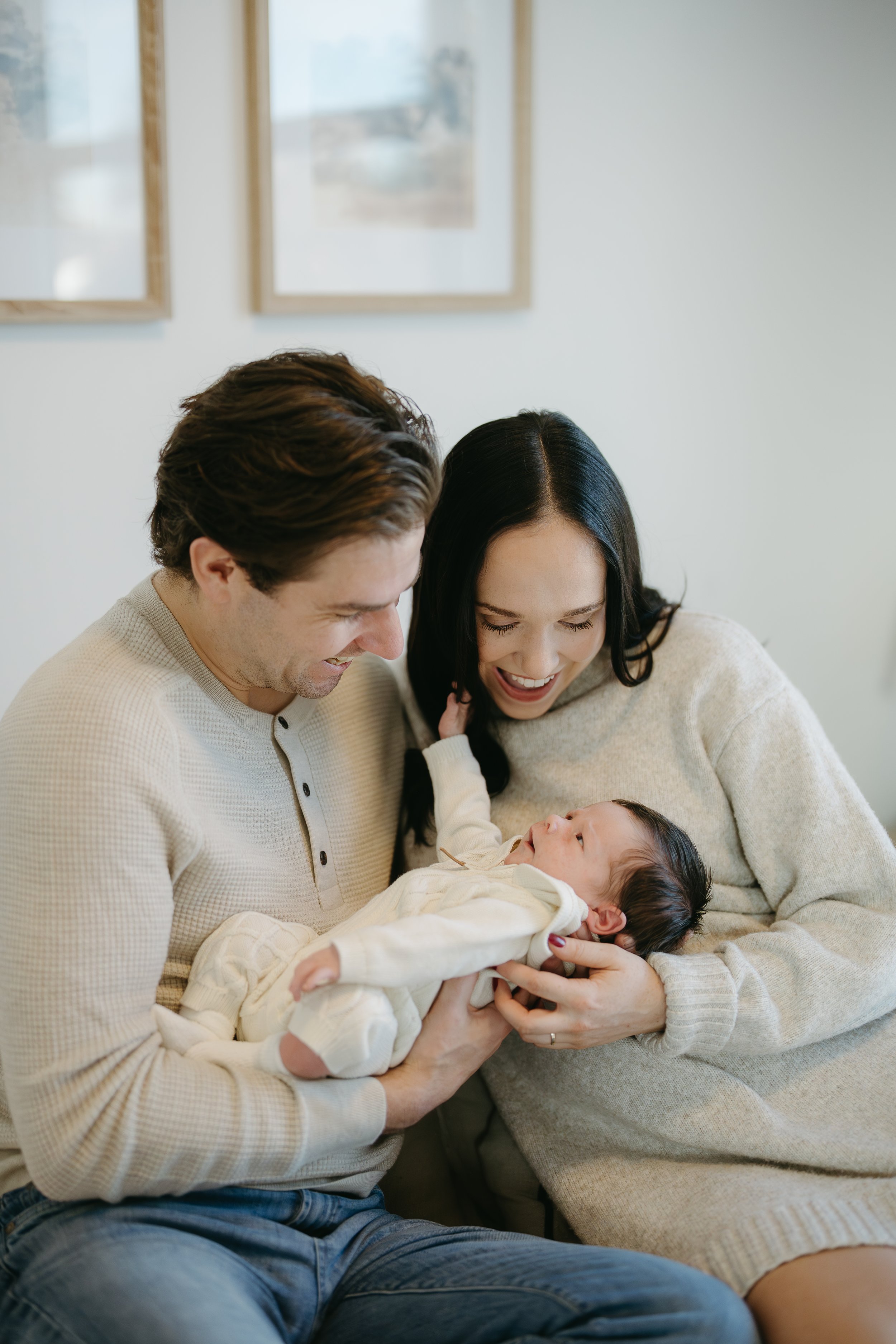 Calgary Alberta Maternity and Newborn Photographer. Mom and day with new baby in newborn photos at home in bedroom