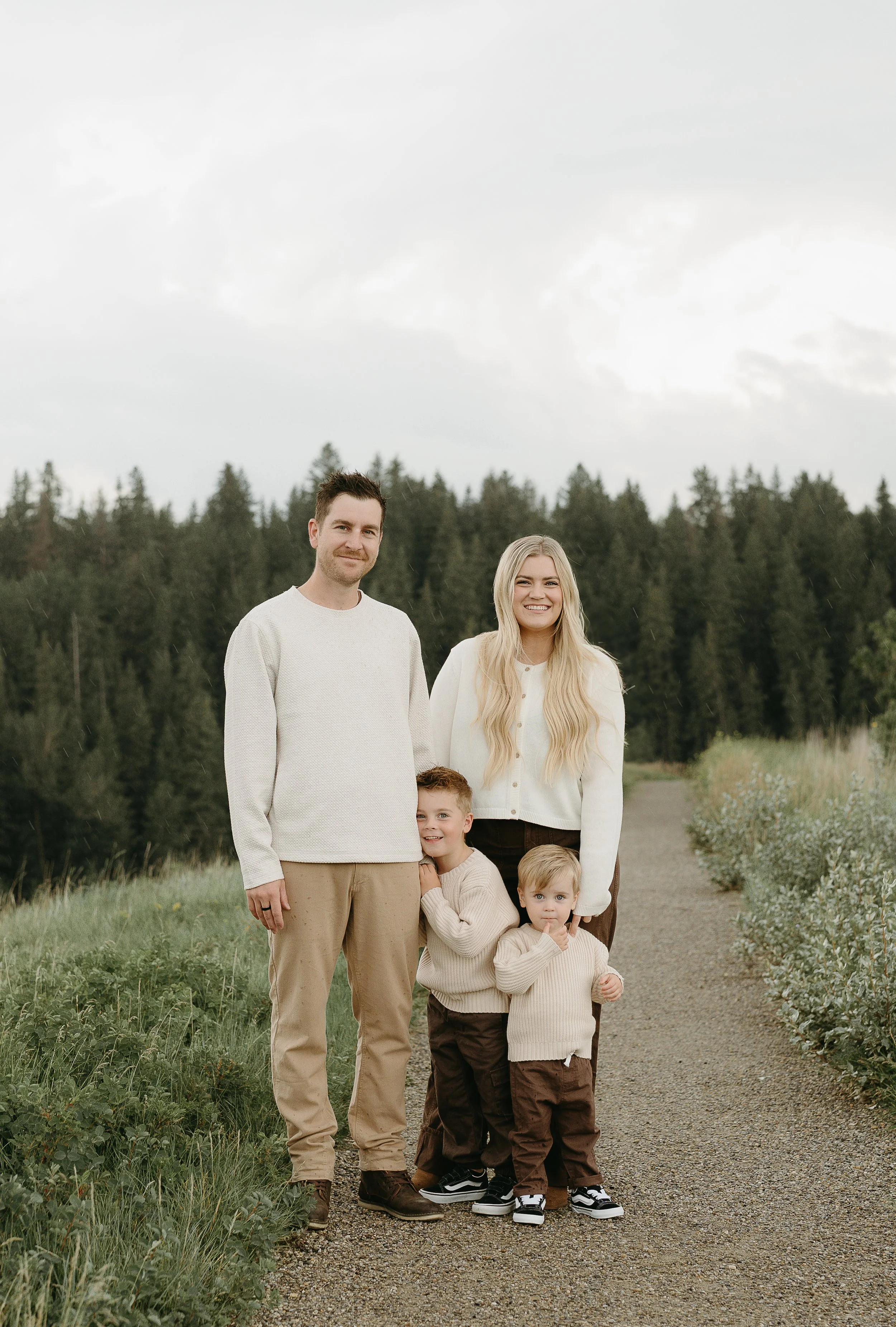 Calgary Alberta Family Photographer.  Family of 4 in a calgary park for family lifestyle photos.