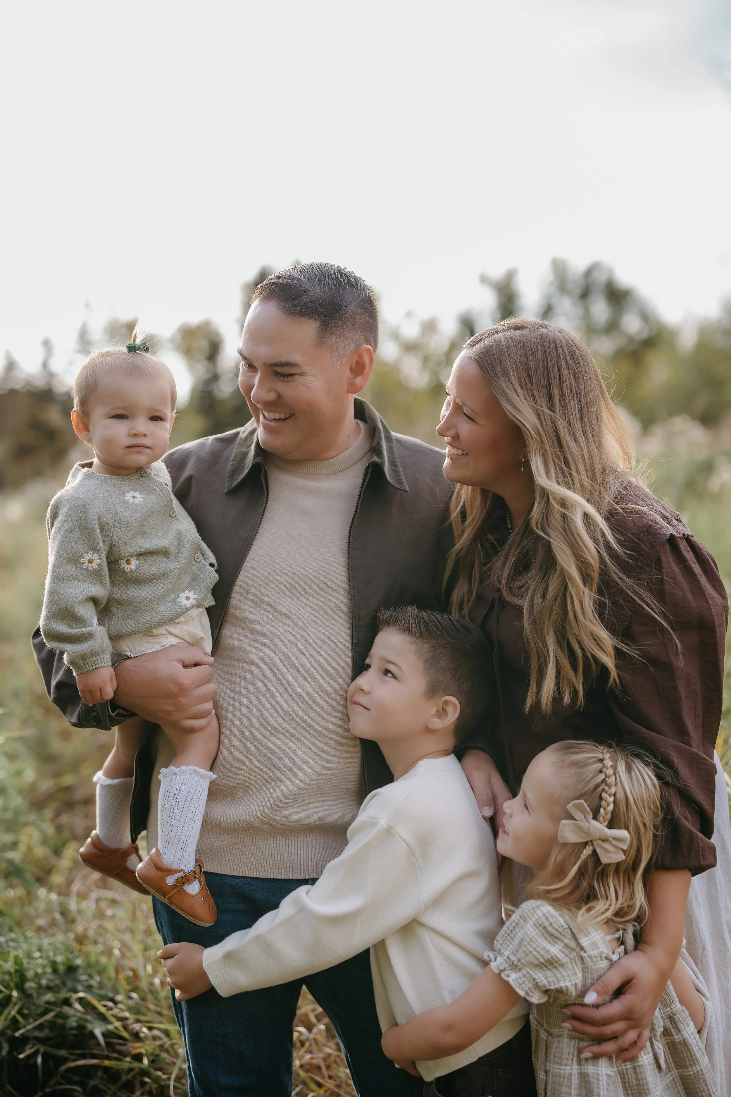 Calgary Alberta Family Photographer. Fall Family Photos of a family in Fish Creek Park