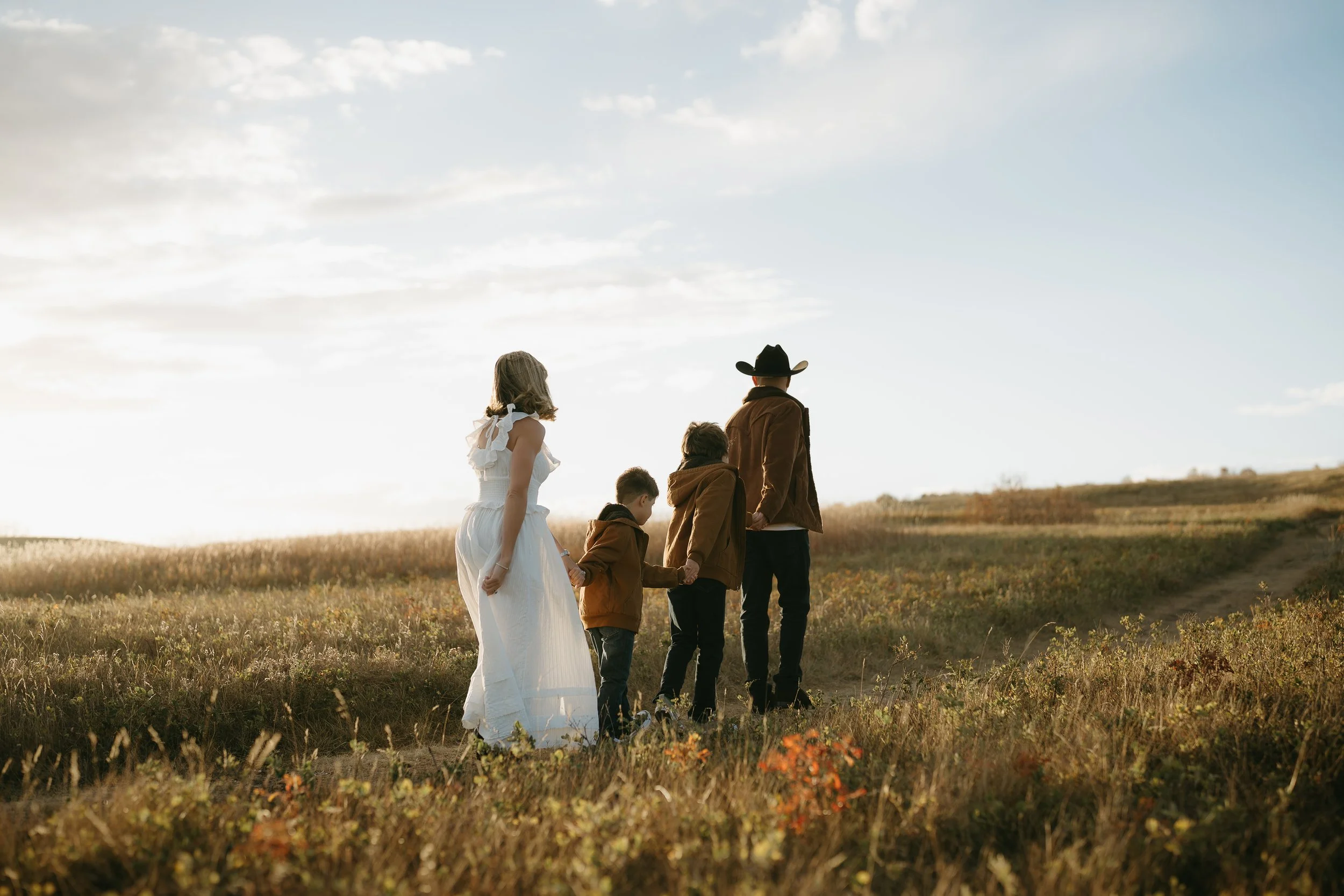 Calgary Alberta Family Photographer. Fall Family Photos of a family in Nose Hill Park