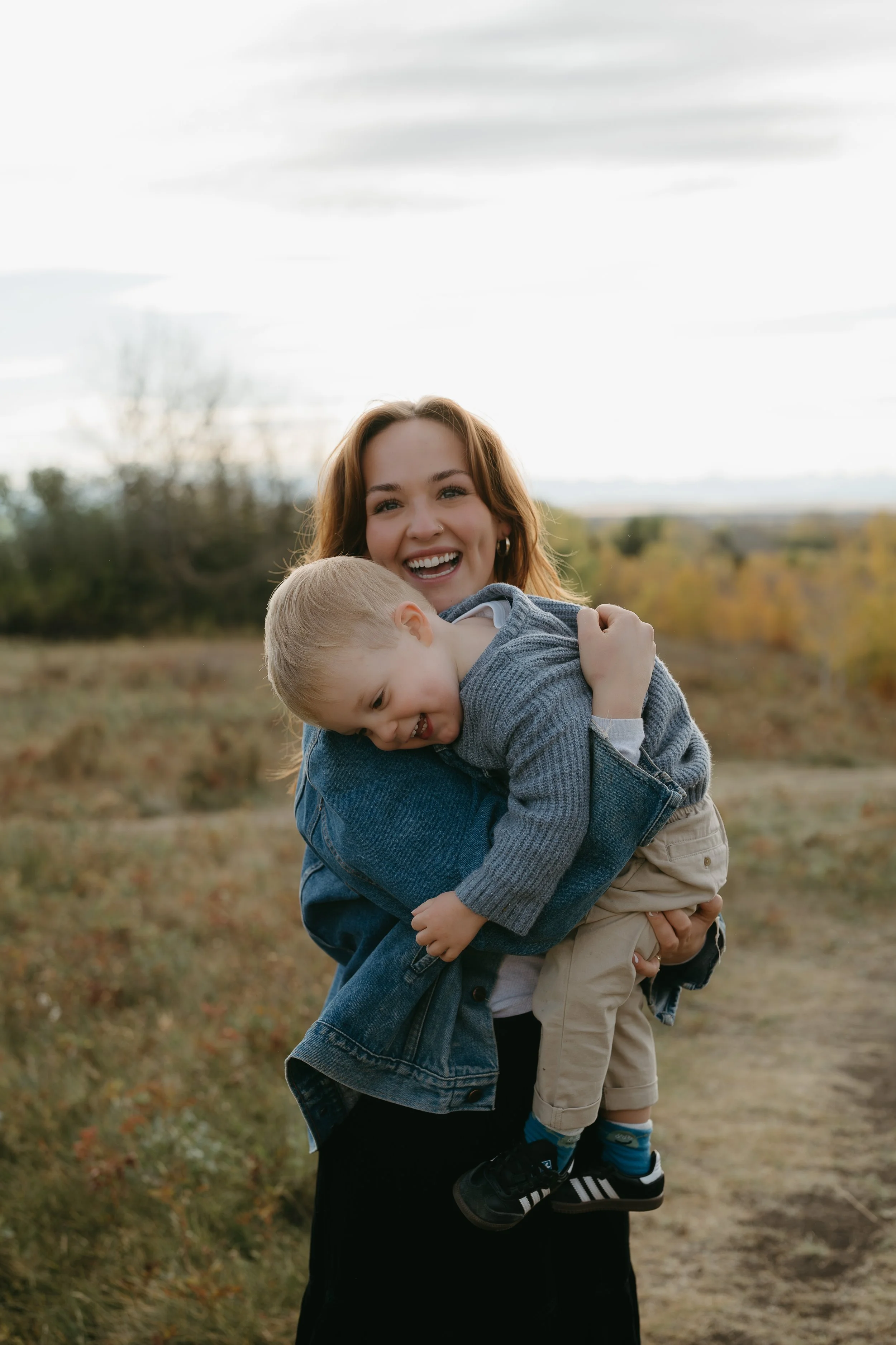 Calgary Alberta Family Photographer. Fall Family Photos of a family in Nose Hill Park