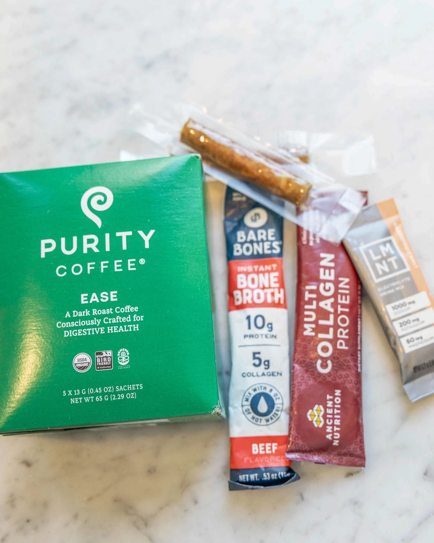 A few things currently living on my counter &mdash; Purity Coffee for digestion, bone broth for protein and collagen, LMNT for electrolytes.
None of this is magic. But when your basics are dialed in, everything else gets easier. What's in your routin