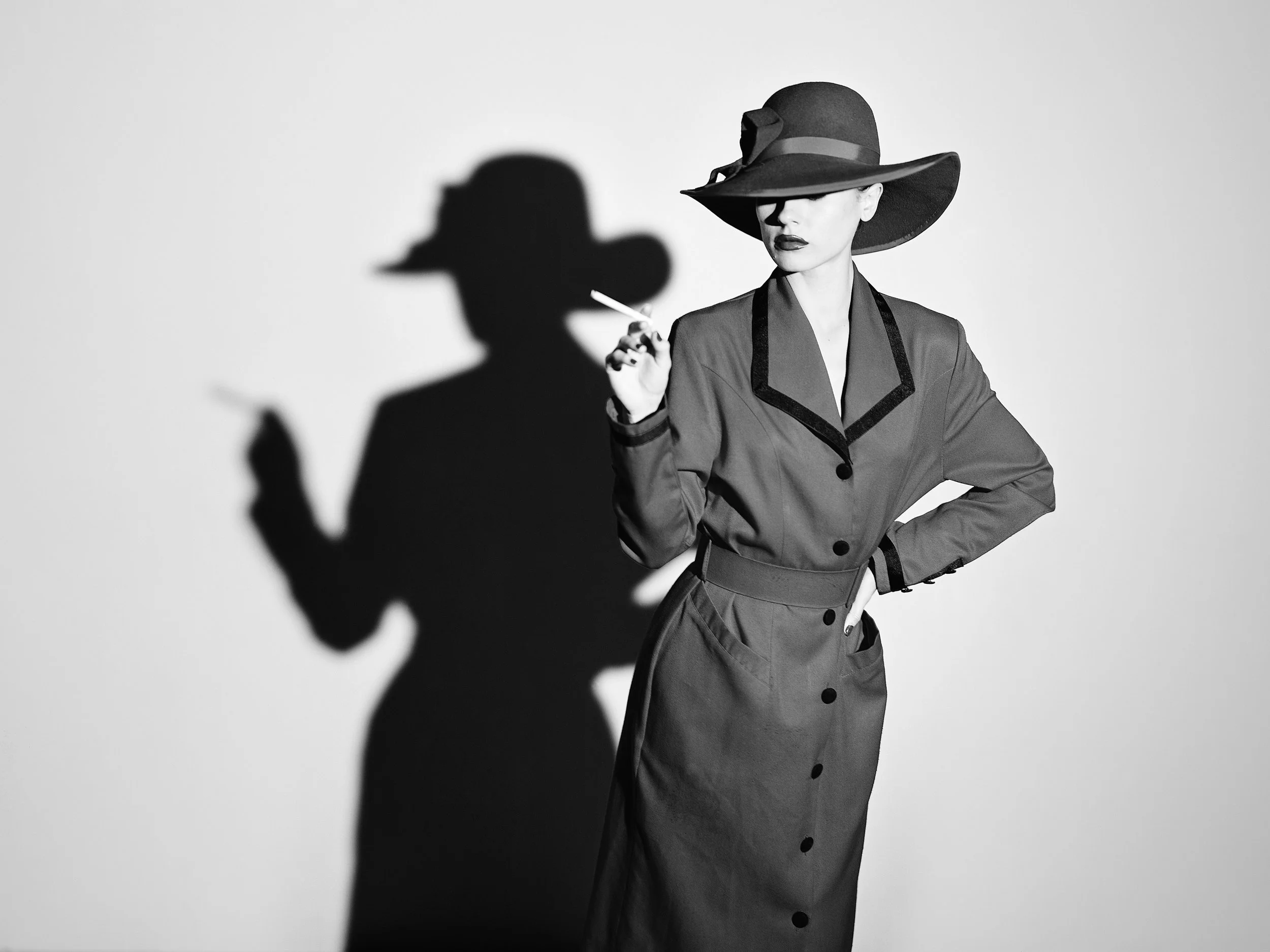 Woman in Suit Smoking