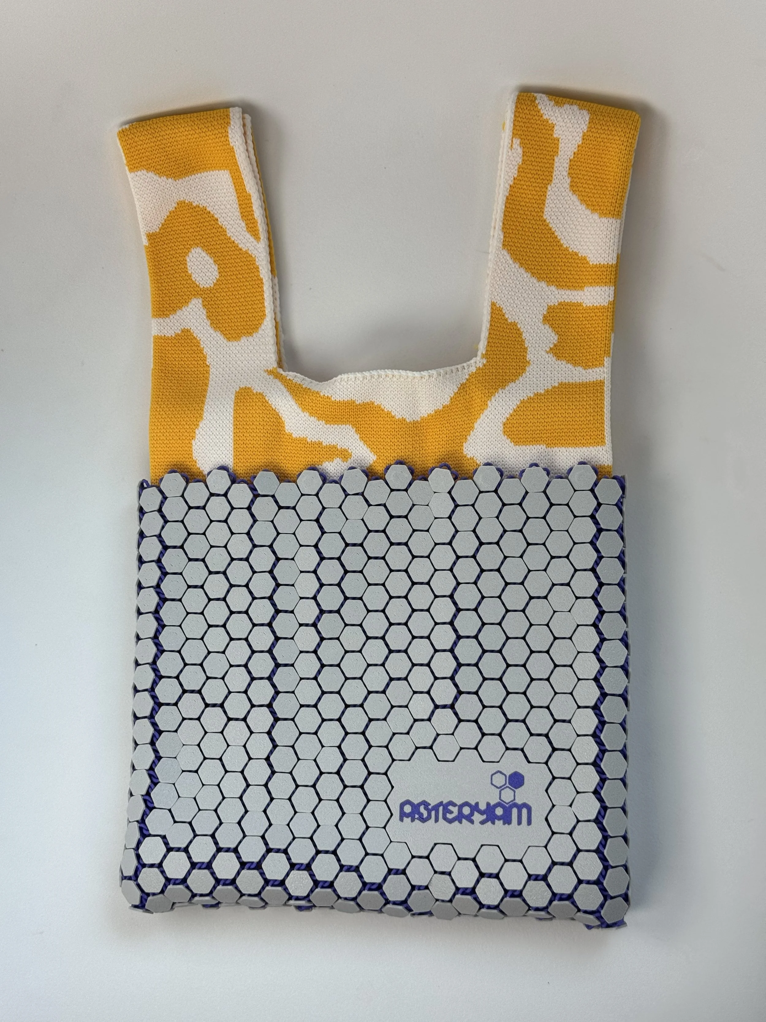 Top-down view showing how the soft yellow knitted liner nests inside the flexible 3D printed shell.