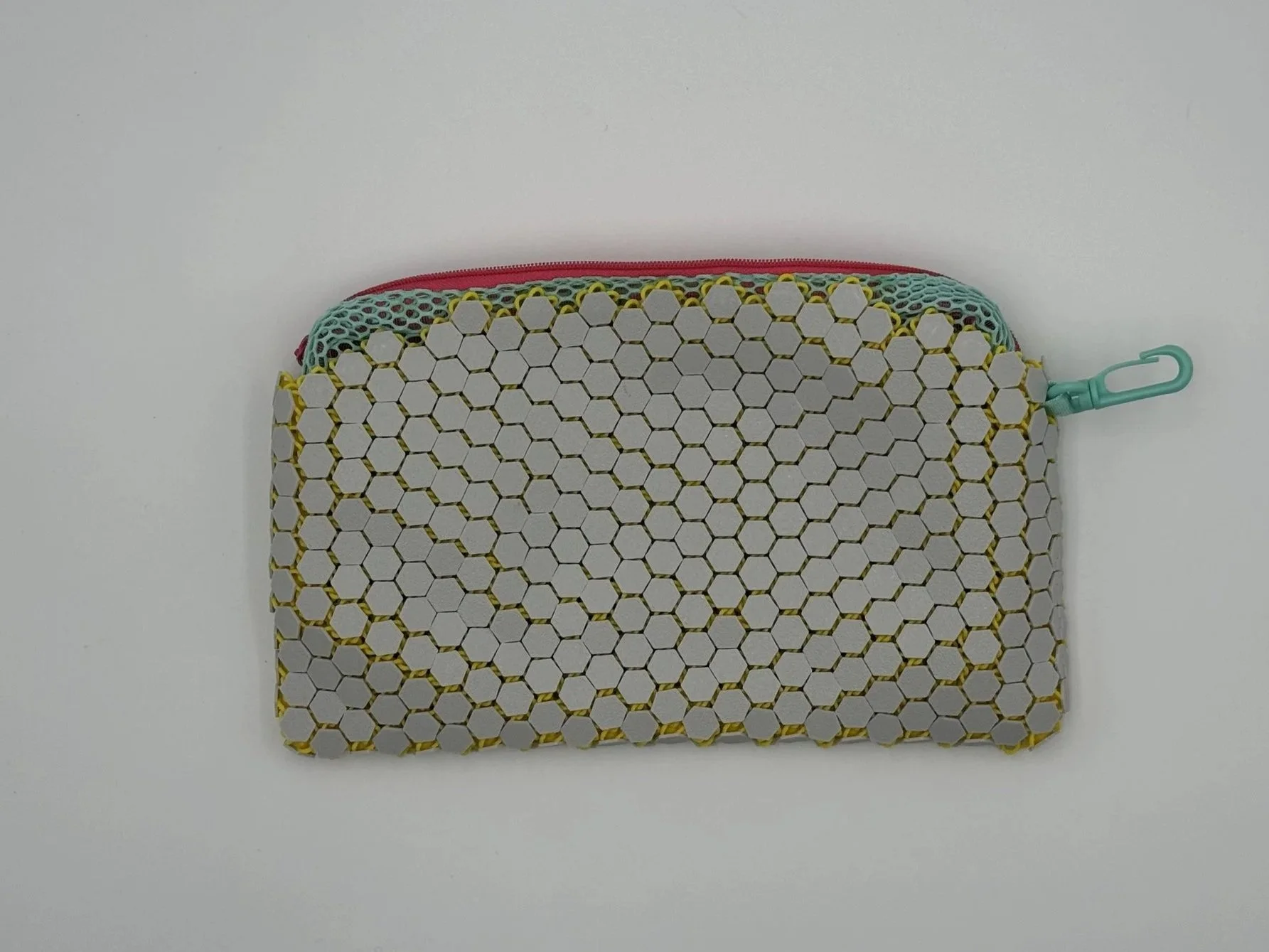 Back view of the ASTERYAM HexaFlux bag showing the continuous, flexible 3D printed chainmail texture in light grey without the logo.