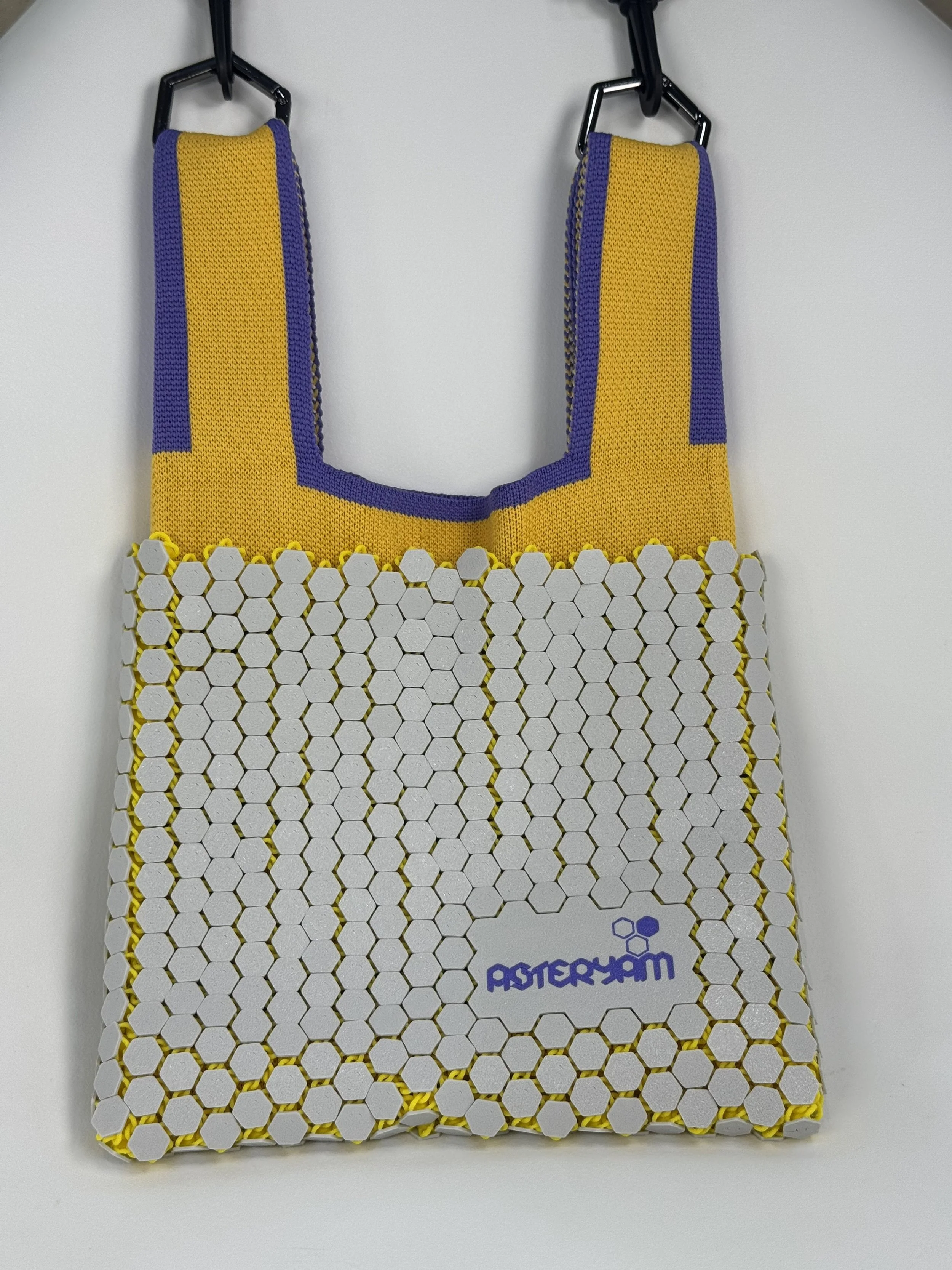 ASTERYAM hand-assembled bag featuring white 3D printed hexagon chainmail over yellow knitted lining, with detachable purple strap, Artisan chainmail purse.jpg
