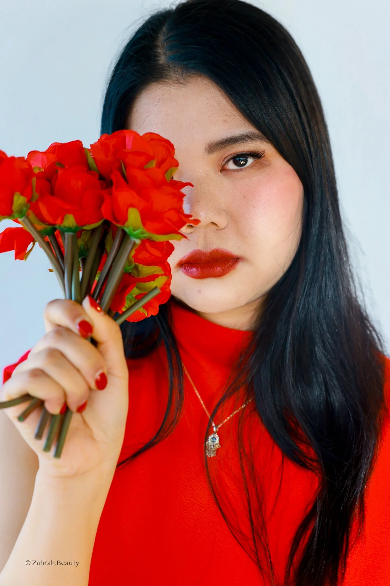 Soft editorial beauty portrait by Zahrah Photo exploring femininity, colour, and cinematic storytelling.