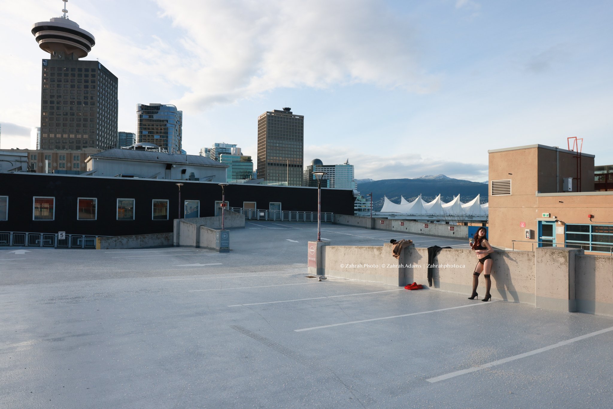 Cinematic boudoir photography by Zahrah Photo capturing femininity, confidence, fashion inspired styling, and atmospheric storytelling through editorial rooftop portraiture in Vancouver.