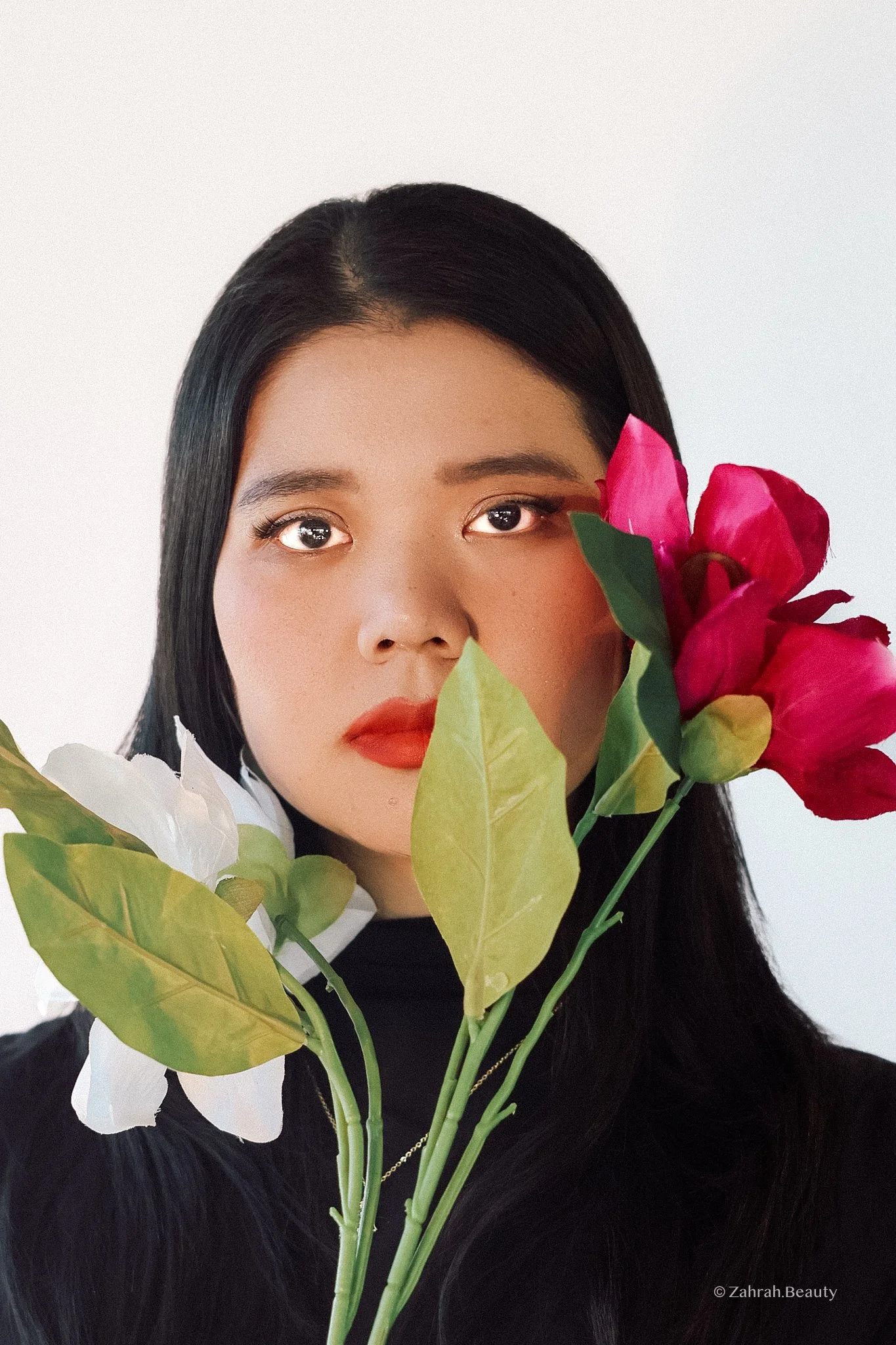 Soft editorial beauty portrait by Zahrah Photo exploring femininity, colour, and cinematic storytelling.