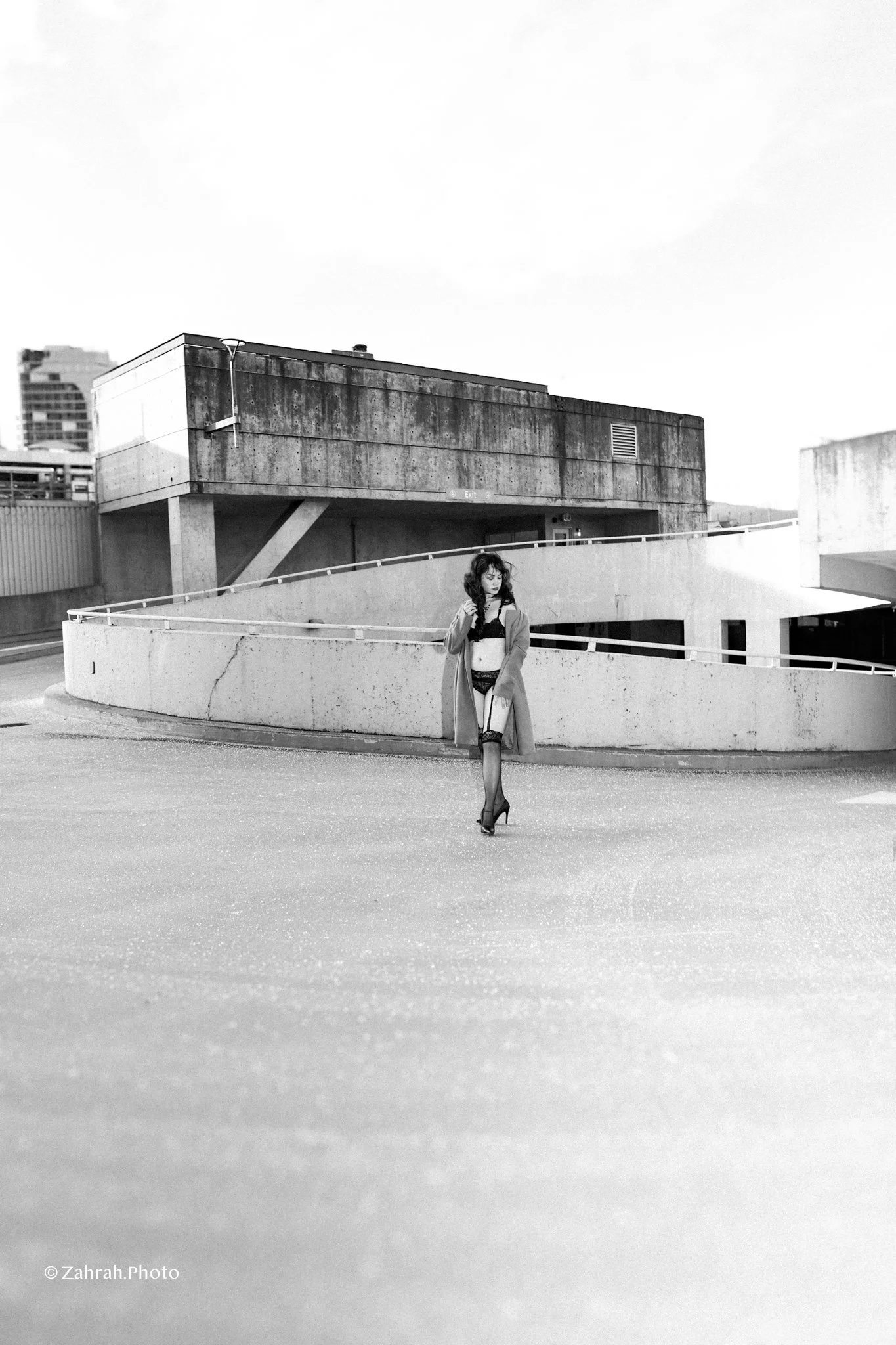 Cinematic boudoir photography by Zahrah Photo capturing femininity, confidence, fashion inspired styling, and atmospheric storytelling through editorial rooftop portraiture in Vancouver.