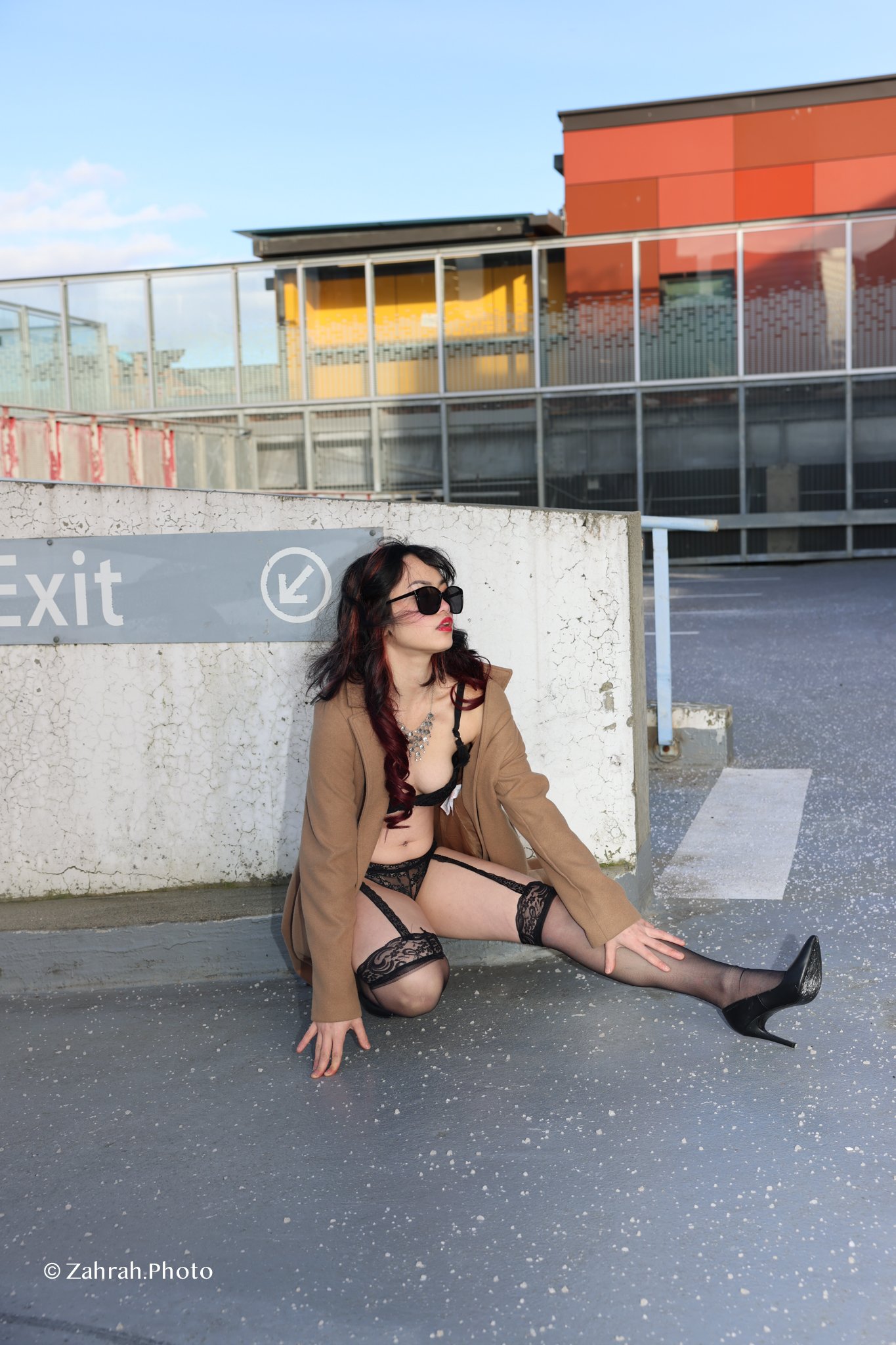 Cinematic boudoir photography by Zahrah Photo capturing femininity, confidence, fashion inspired styling, and atmospheric storytelling through editorial rooftop portraiture in Vancouver.