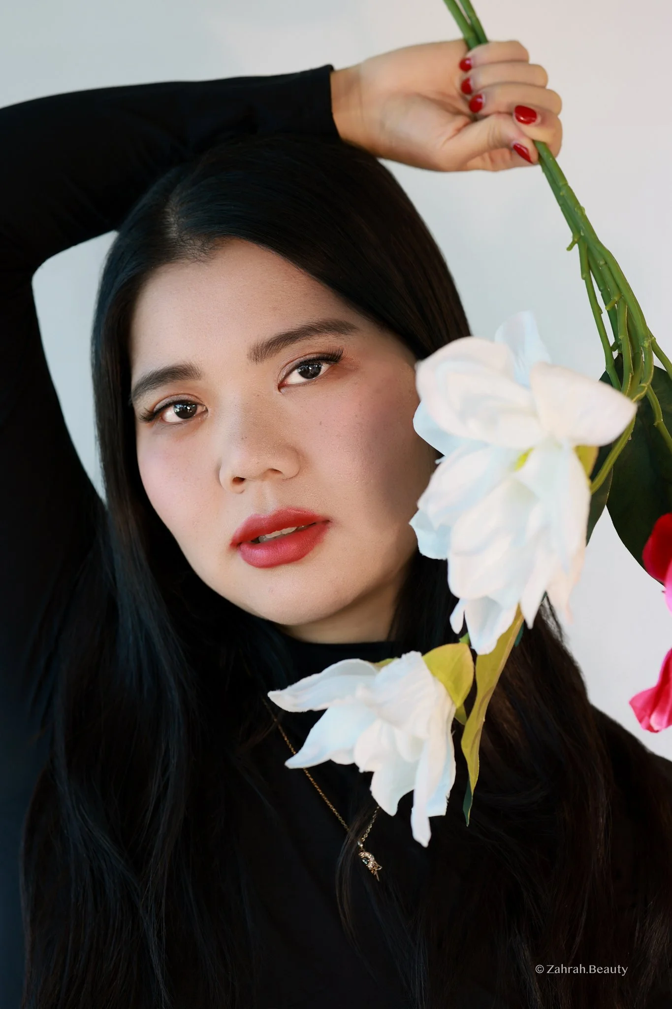Soft editorial beauty portrait by Zahrah Photo exploring femininity, colour, and cinematic storytelling.