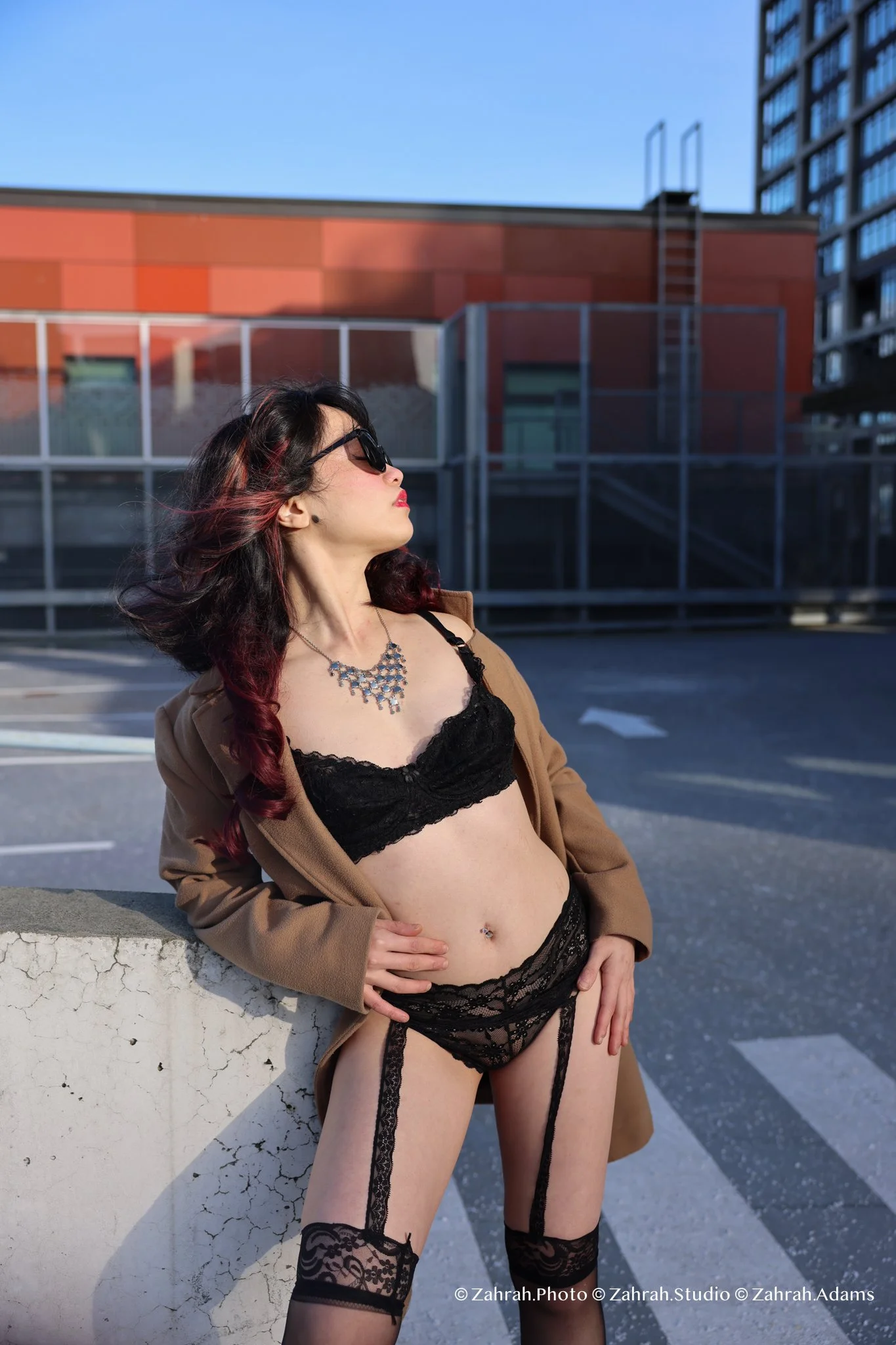 Cinematic boudoir photography by Zahrah Photo capturing femininity, confidence, fashion inspired styling, and atmospheric storytelling through editorial rooftop portraiture in Vancouver.