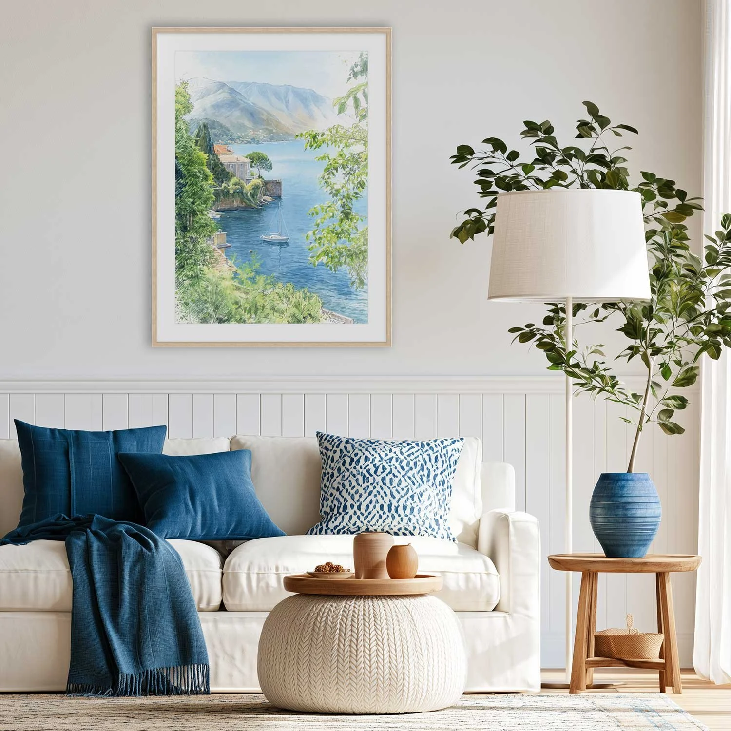 Como Morning digital painting of Lake Como on canvas and hanging on a light wall above a white sofa with blue accessories