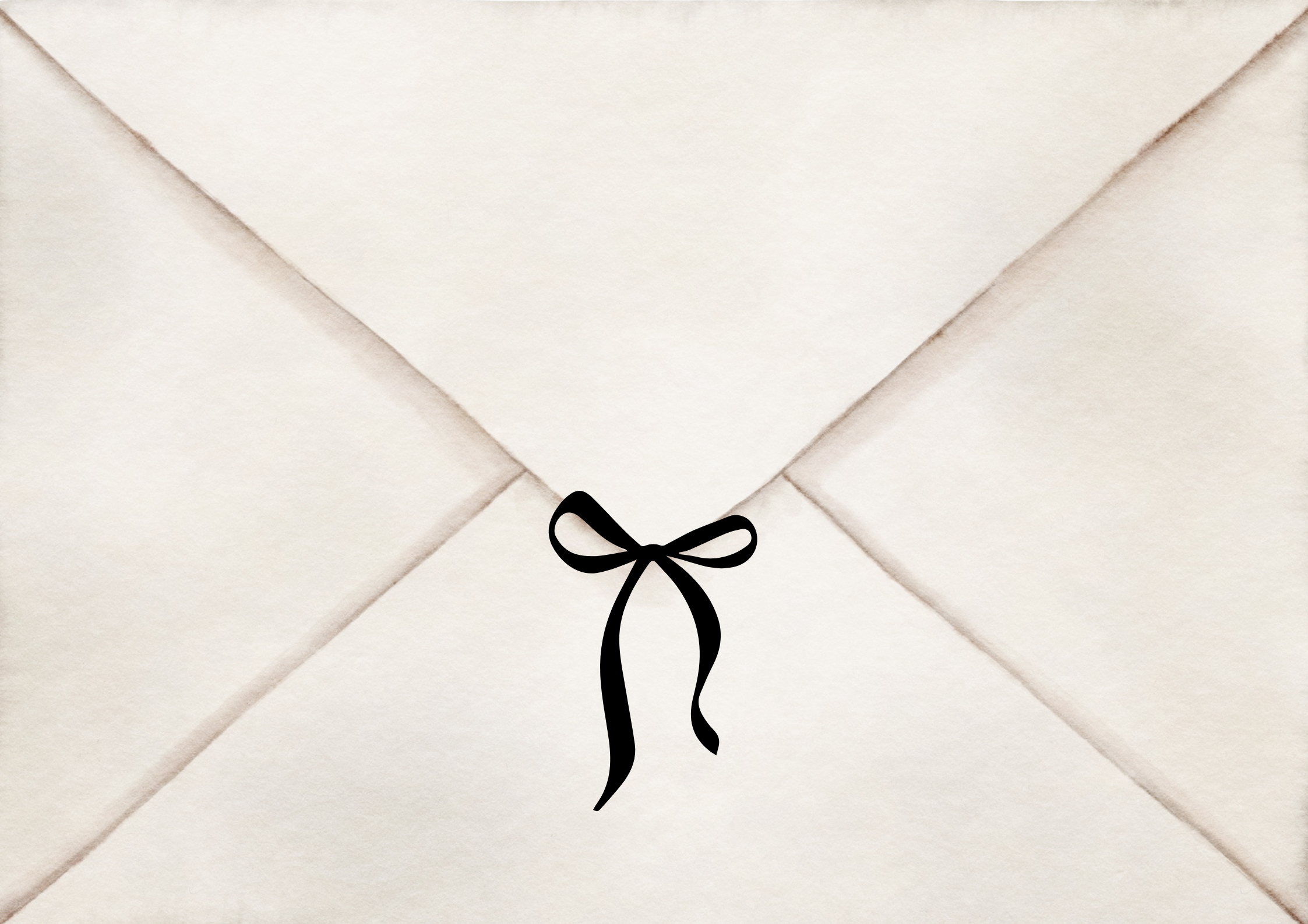 Close-up of white paper envelope sealed with a black ribbon tied in a bow.