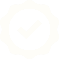 A badge or seal with a checkmark in the center, indicating approval or verification.