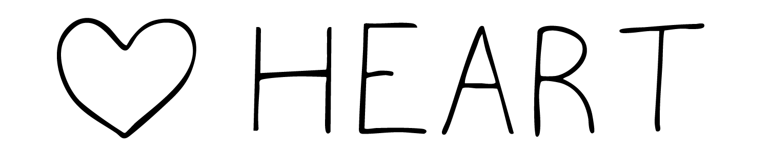 A black crow perched on a green ivy-covered branch in a leafy outdoor setting.