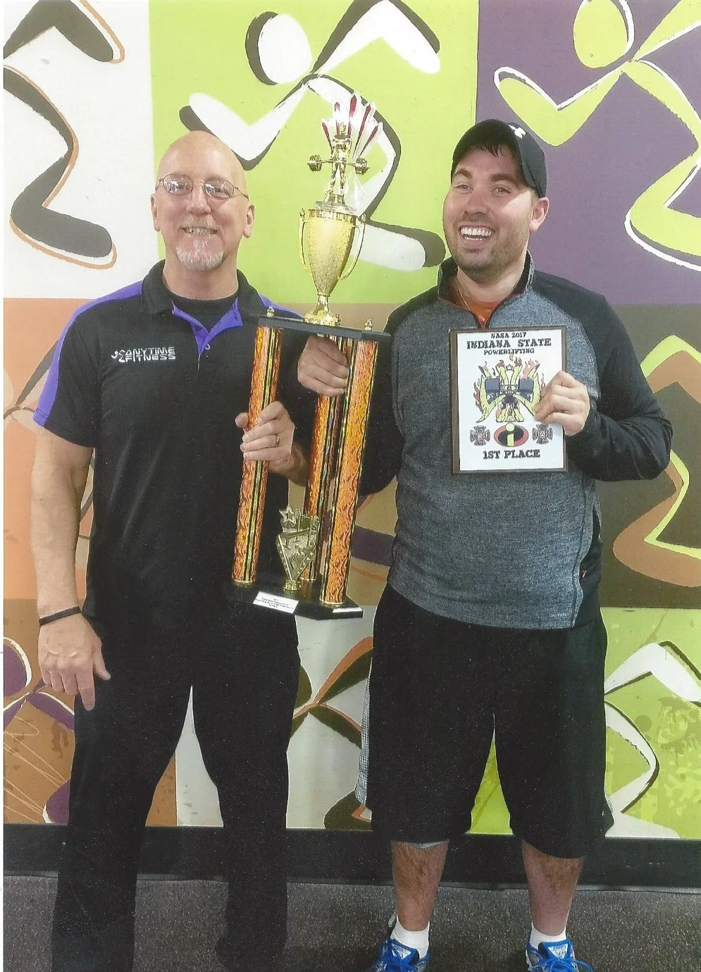 Travis and his trainer Joe after winning a weight lifting competition. Travis was a body builder before his accident, so he is right at home in the gym.