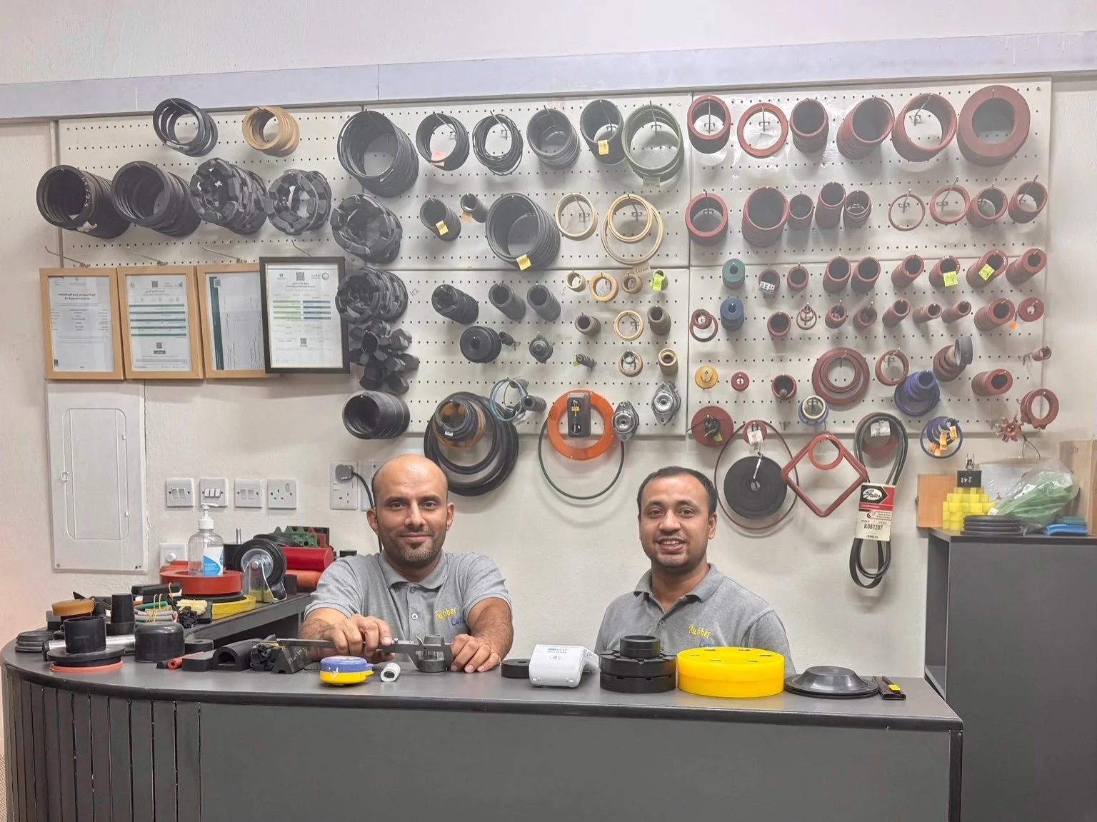 Rubber Corner team offering technical support and custom rubber parts solutions.