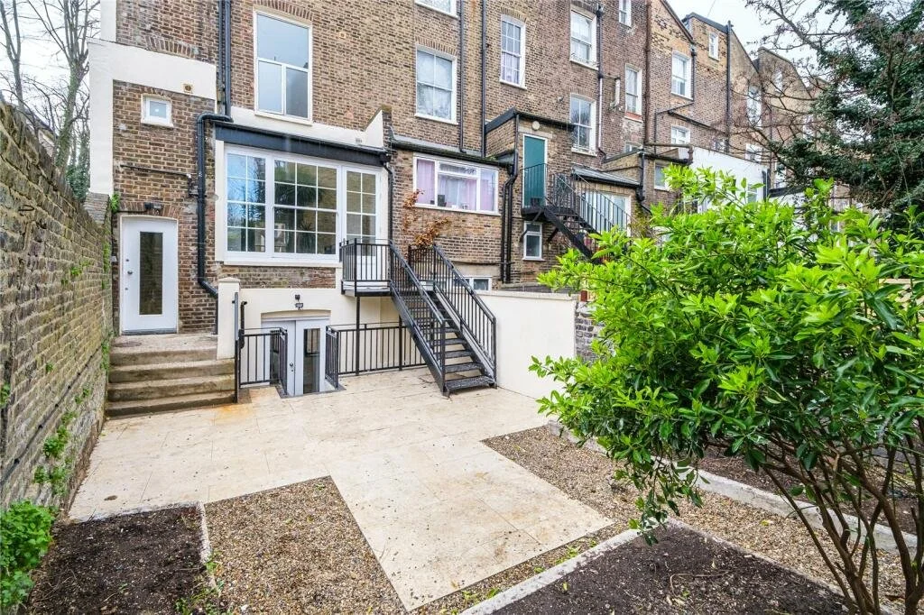 Another photo of an unloved and unpractical garden before the new garden design was installed, as part of a before/after.