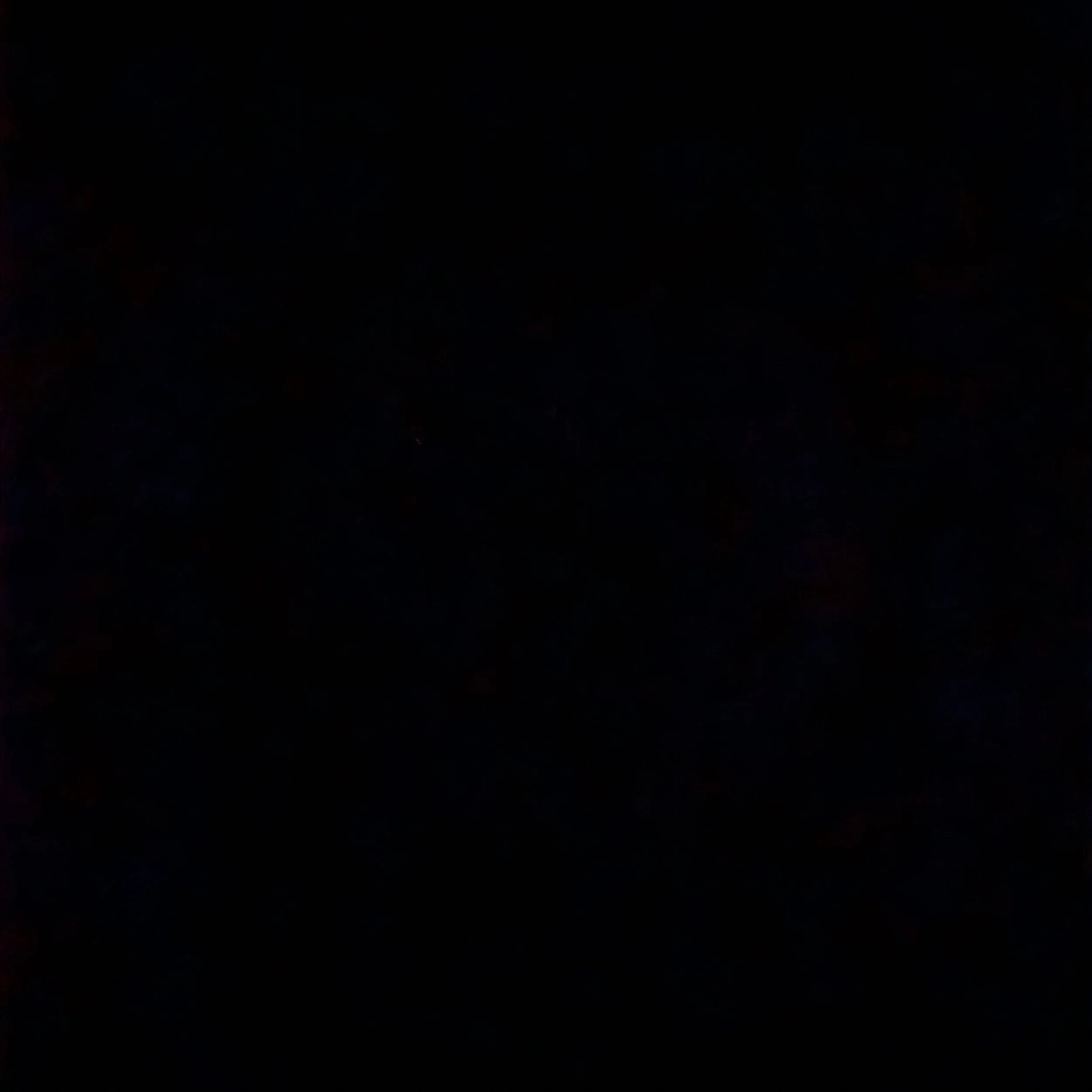Very dark image with no distinguishable objects or details visible.