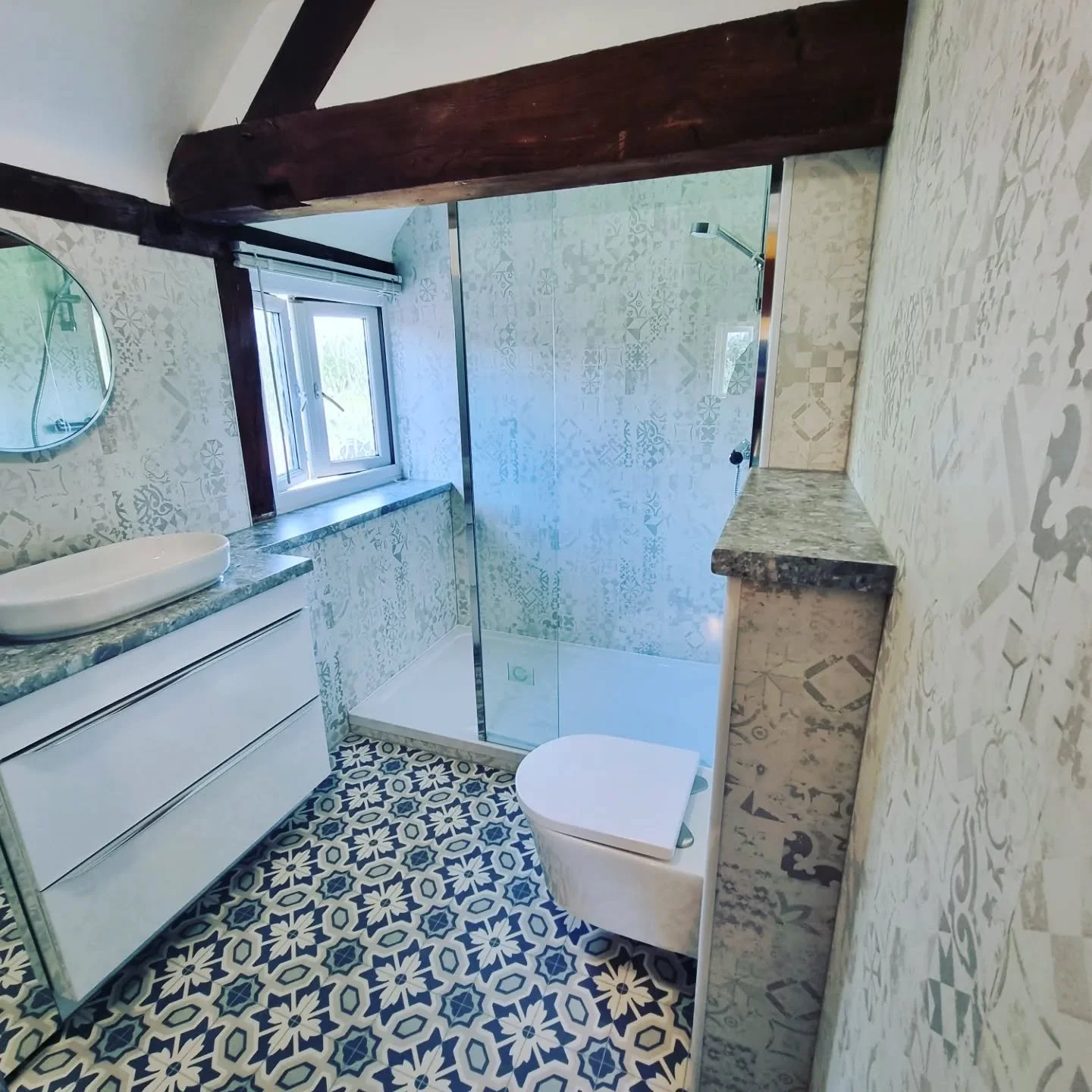 Lovely transformation in Defford using clients' choice of patterned wall and floor coverings #bathroomdesign #bathroomdecor #bathroomremodel #bathrooms #bathroomrenovation #worcesterbathrooms #worcestertile #showerpanel