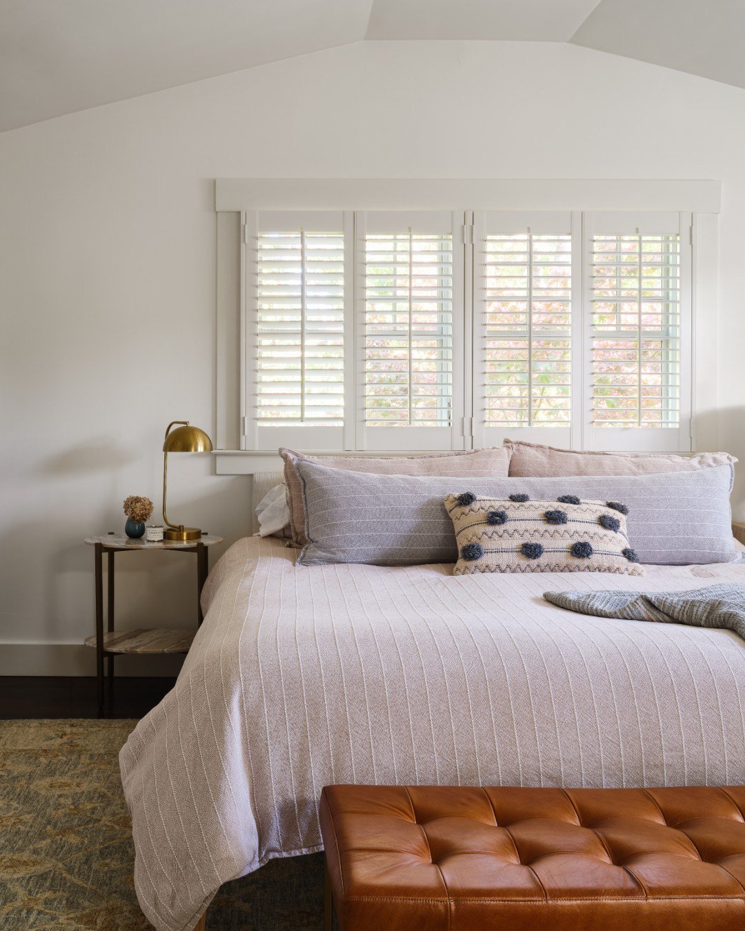 Swipe to the end to see what this space looked like before! What was once a tired, dated bedroom is now a calm, welcoming retreat designed for real life. This 1975 contemporary home received a thoughtful refresh, and the primary bedroom was no except