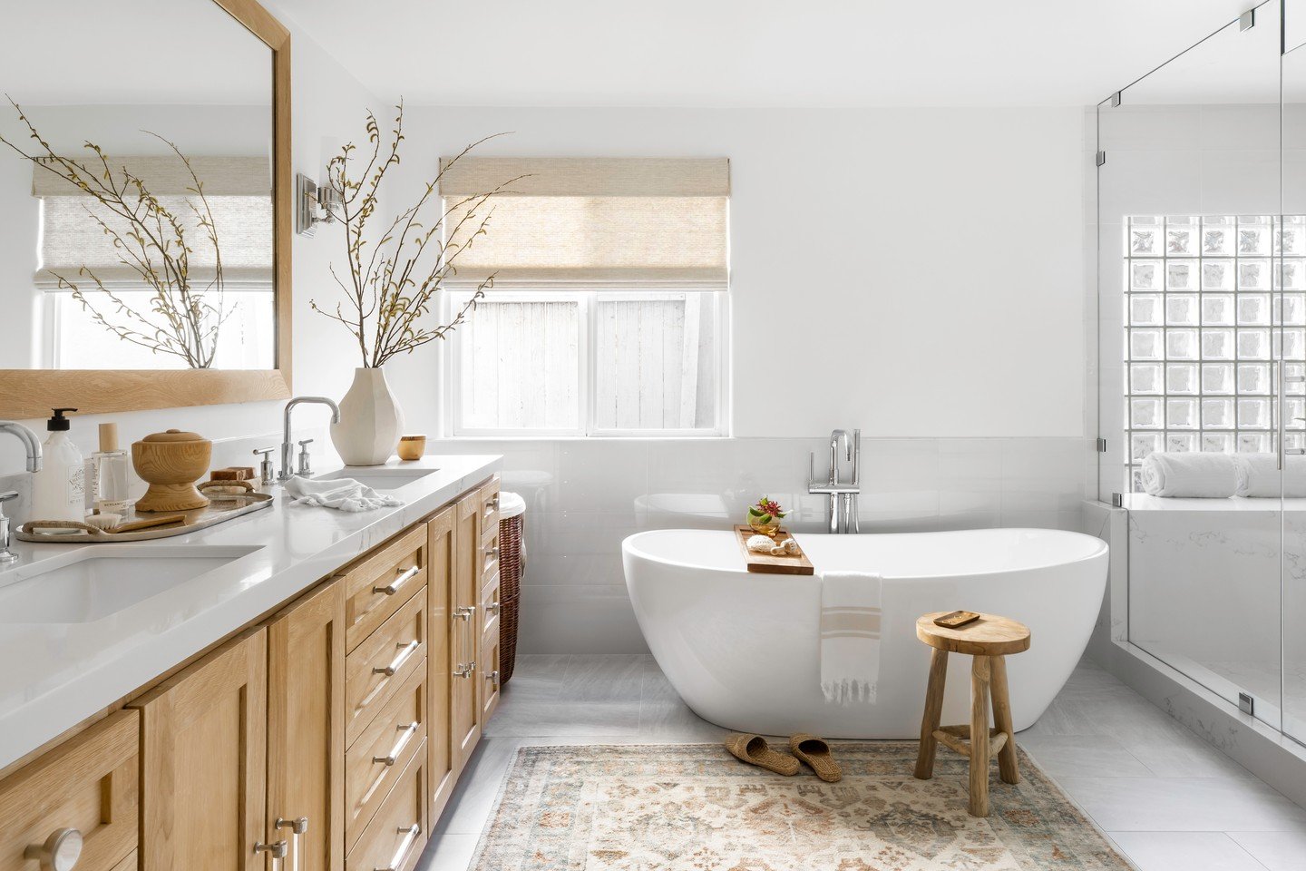 A quiet moment in the midst of a full house 🤍

This spa-like soaking tub was designed as a serene retreat within a beautifully refreshed 1975 contemporary home. With three little boys under six, durability and function were essential throughout, but