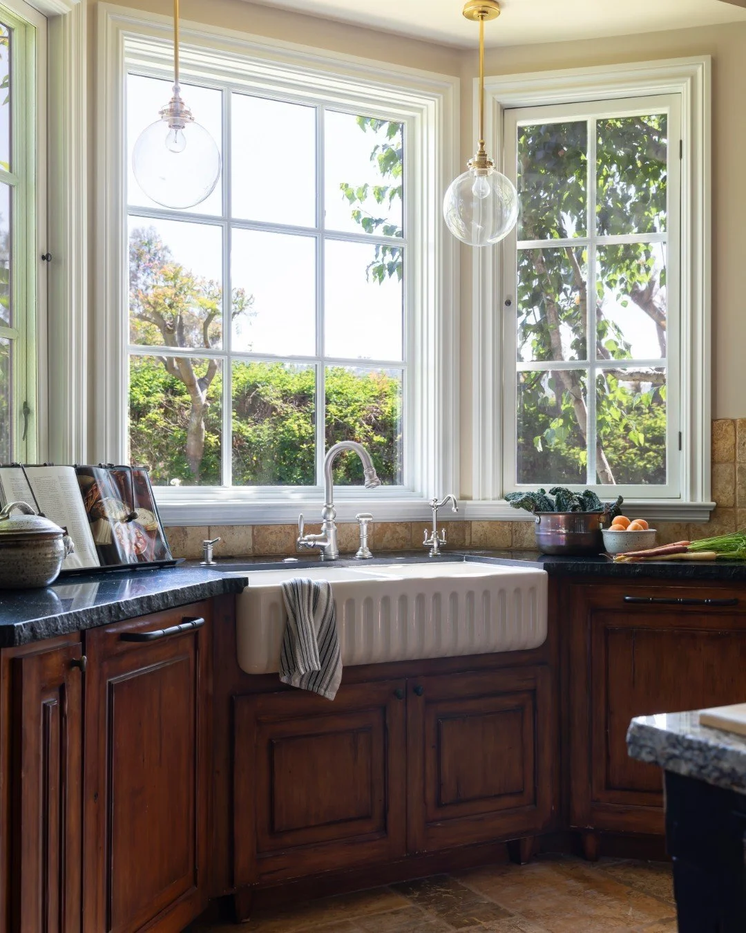 Stained vs. painted cabinets&mdash;why choose when you can have both? 

The kitchen at The Refined French Country Home is the perfect example of how beautifully the two can live together. The warmth of stained wood brings depth, texture, and a sense 