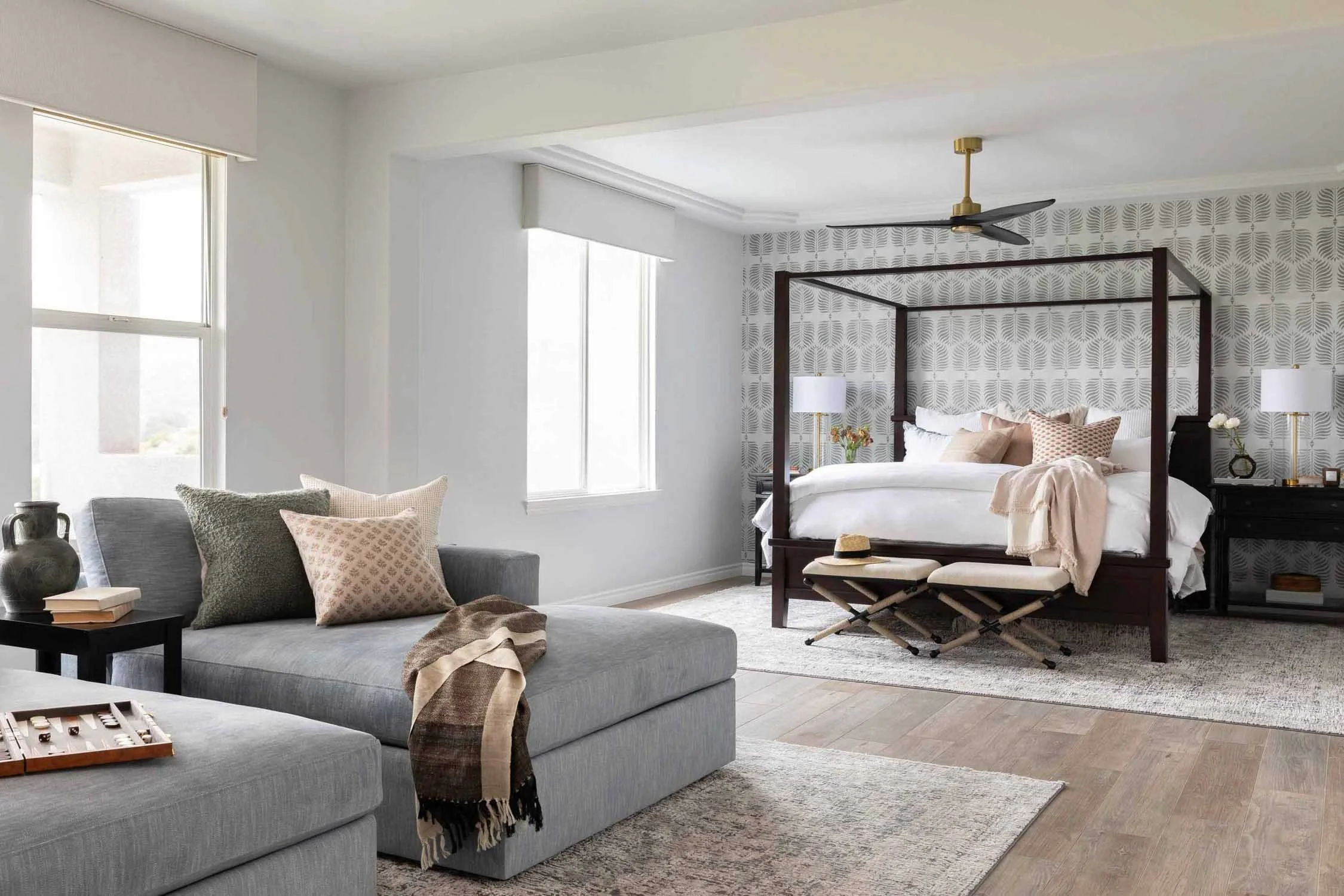 Primary bedroom with attached sitting area and neutral design, created by JKB Home Design, Aliso Viejo