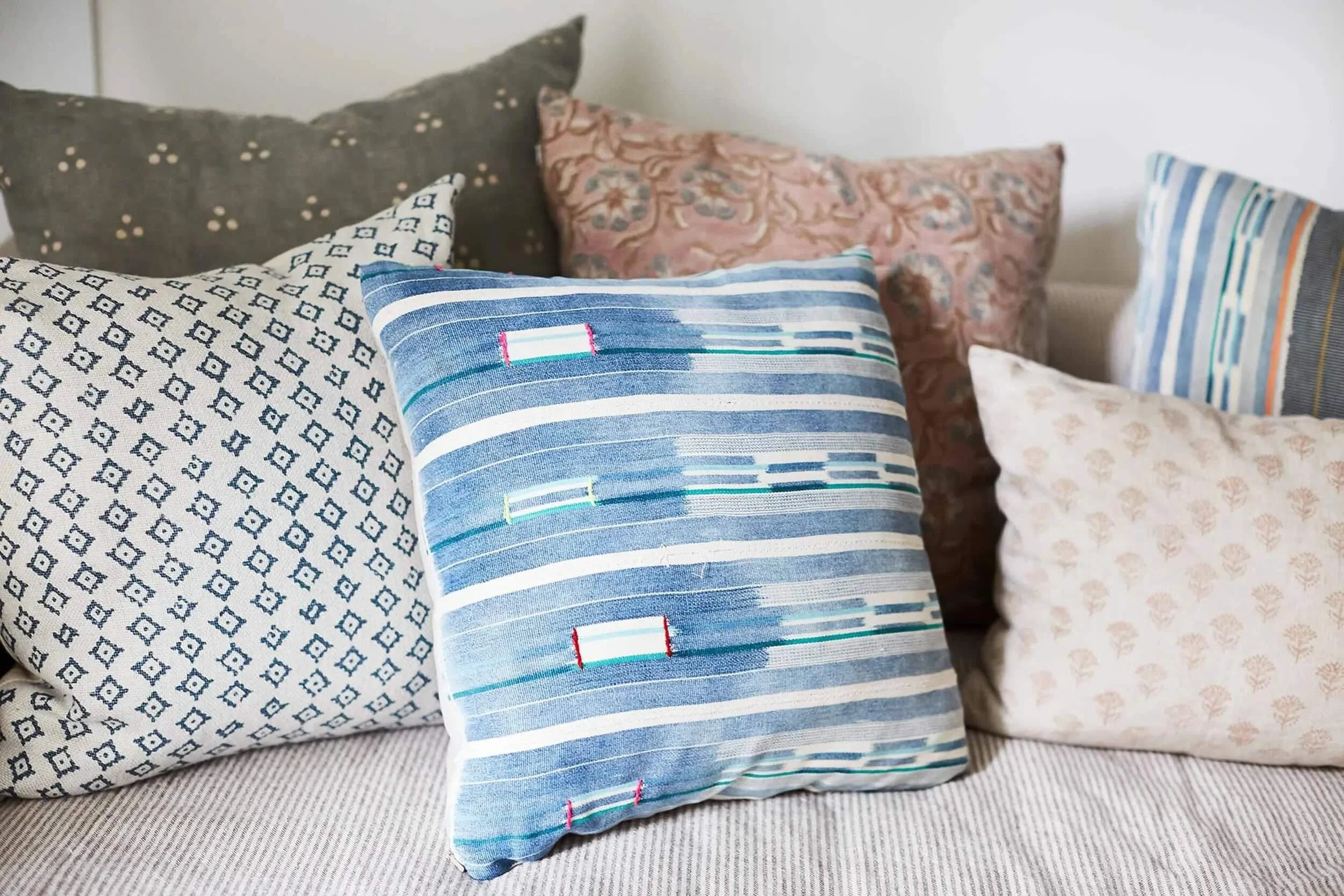 Patterned throw pillow detail in eclectic bedroom, designed by JKB Home Design