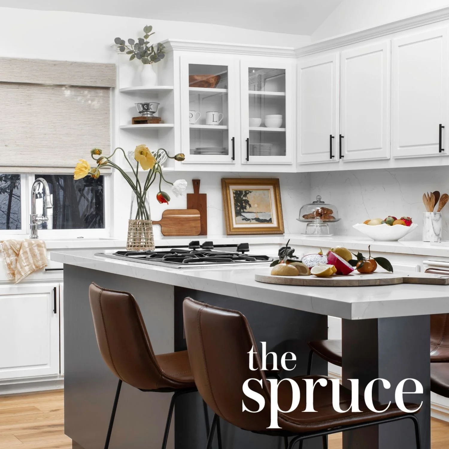 Light modern kitchen by JKB Home Design, featured in The Spruce