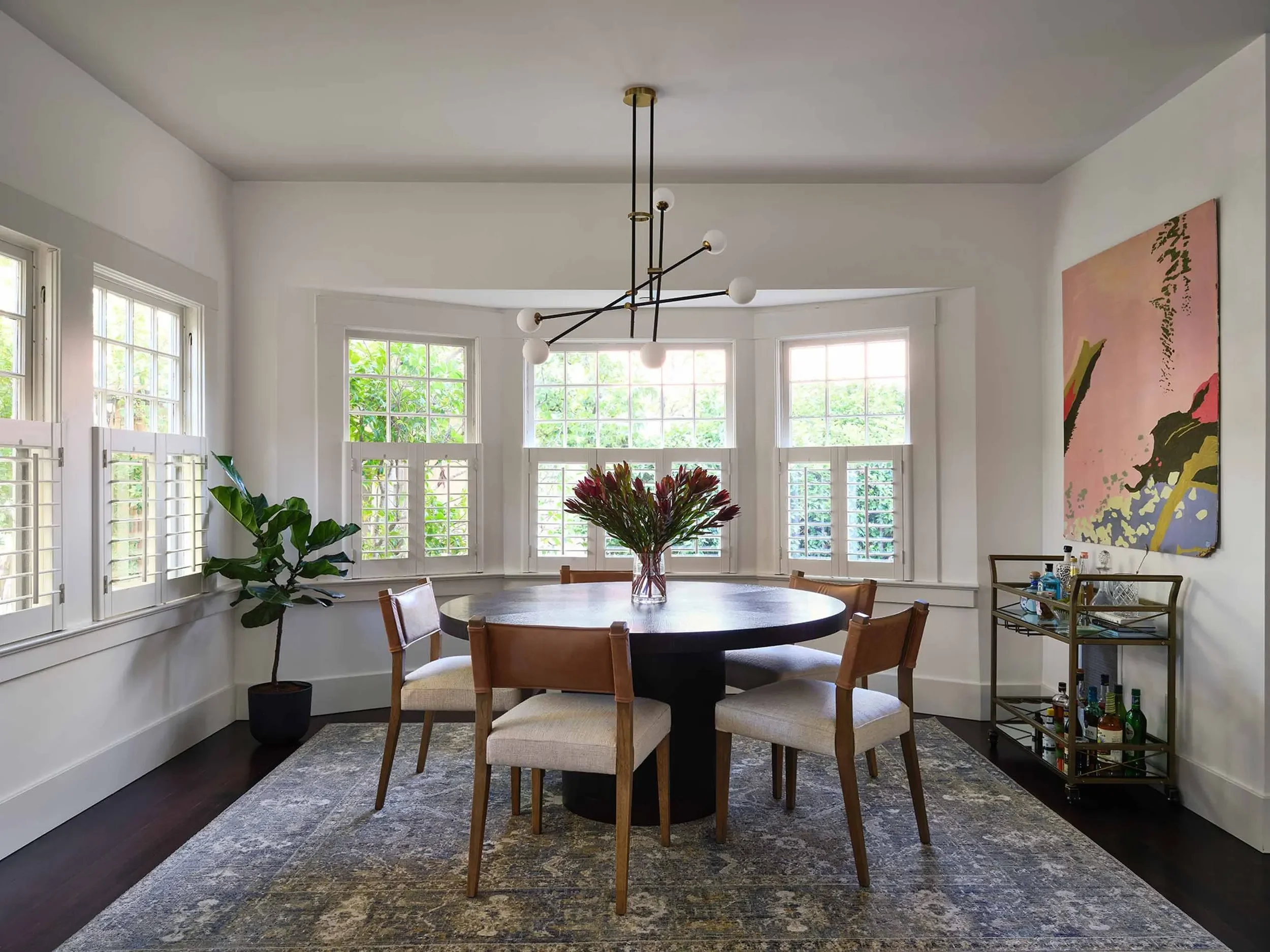 Round dining table in eclectic San Anselmo, CA home, designed by Julie Beuerlein, interior designer