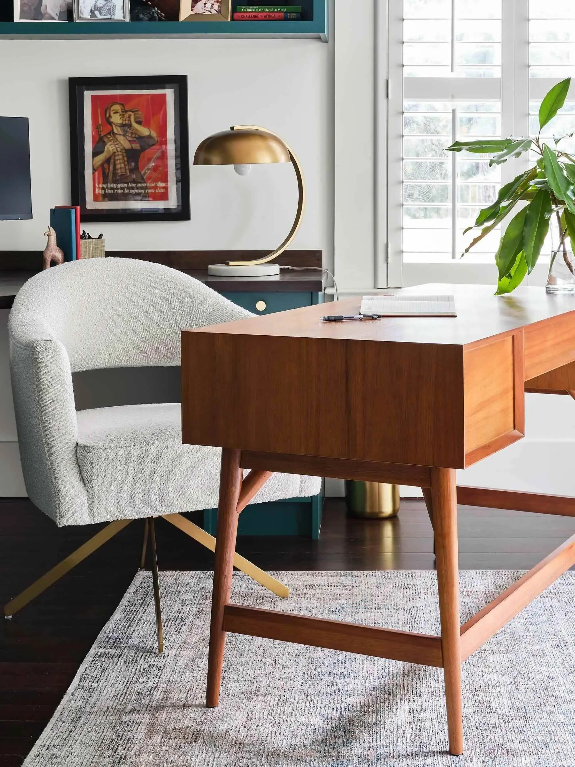 Cottage office space with wood desk and shelving, designed by Julie Beuerlein, interior designer