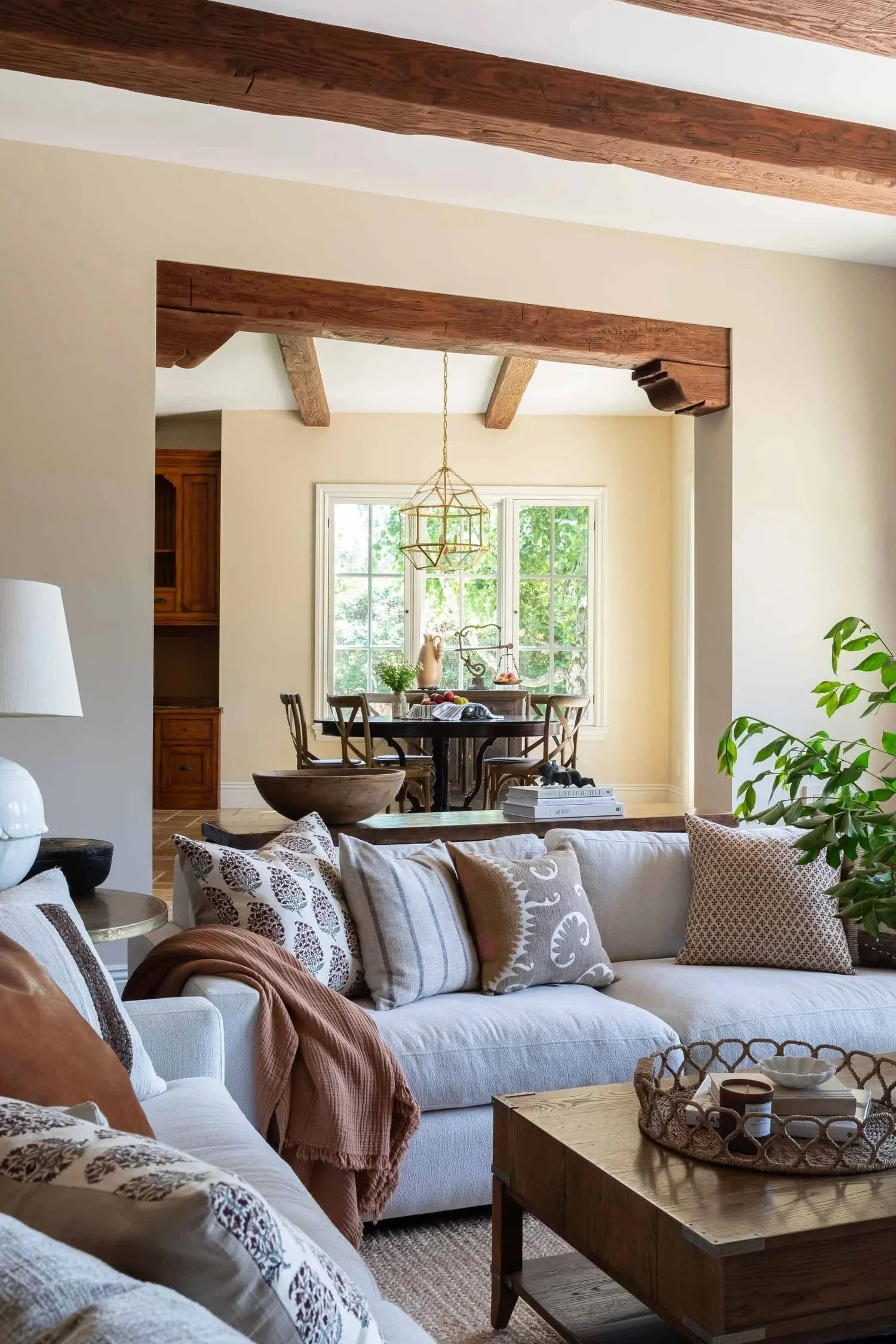 French Country living room with rustic elegance and wood beams, designed by JKB Home Design, Palos Verdes