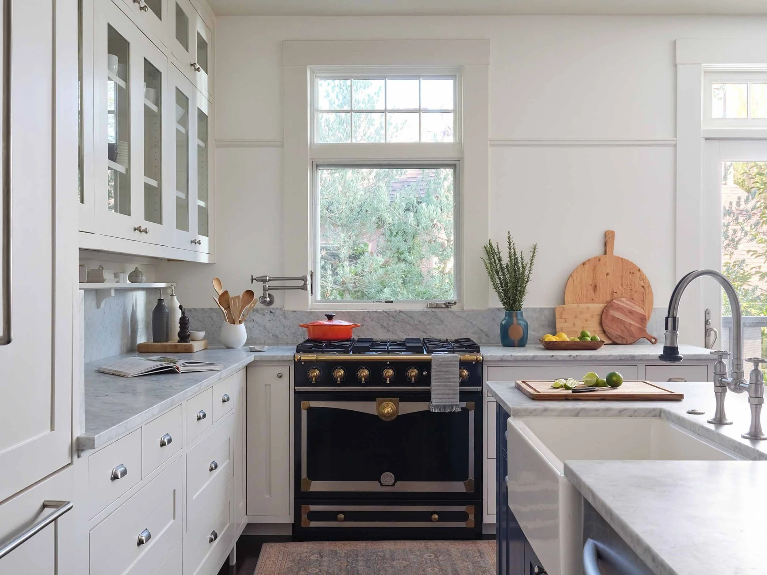 Blue island kitchen with stone counters in San Anselmo, designed by JKB Home Design