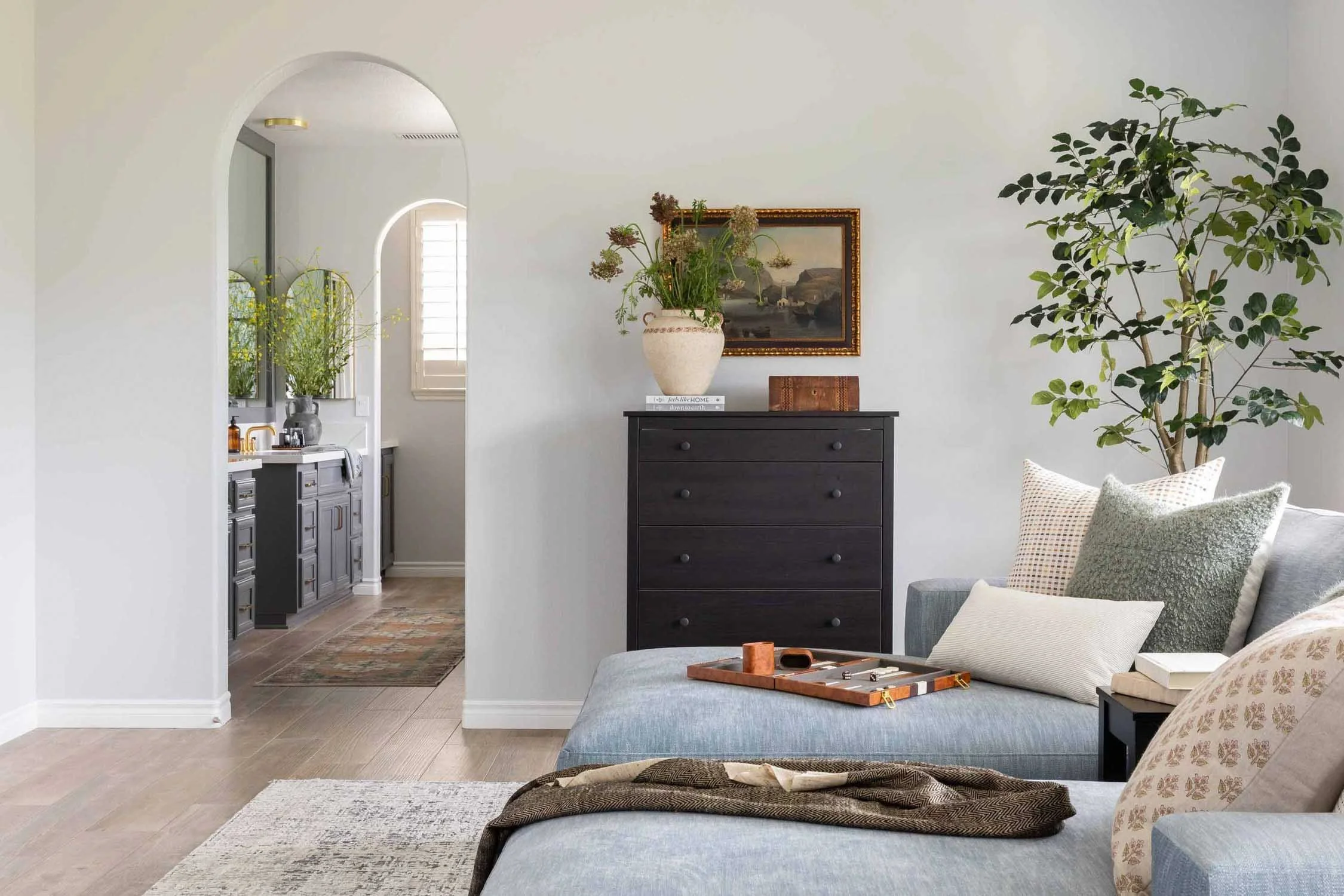 Southern California bedroom sitting area with neutral finishes, designed by JKB Home Design
