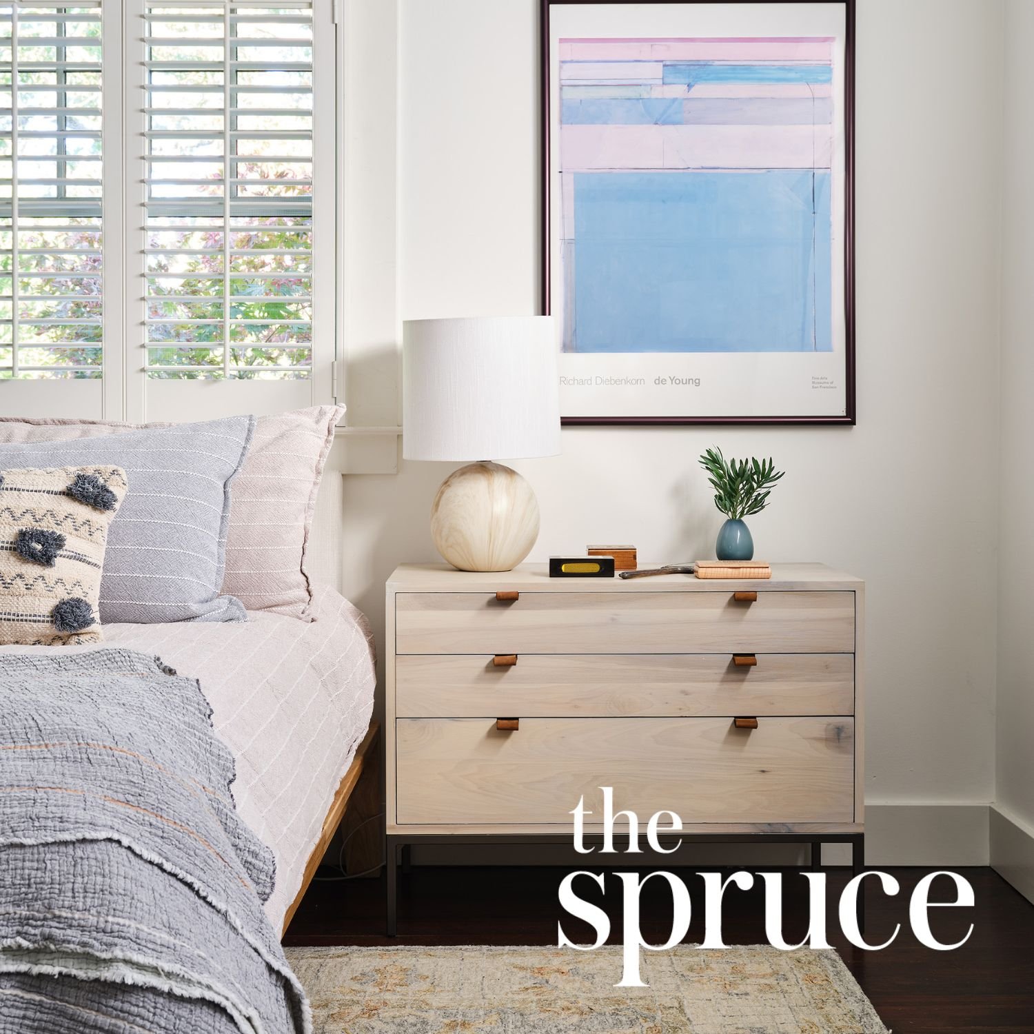 Coastal bedroom interior design by Julie Beuerlein, featured in The Spruce