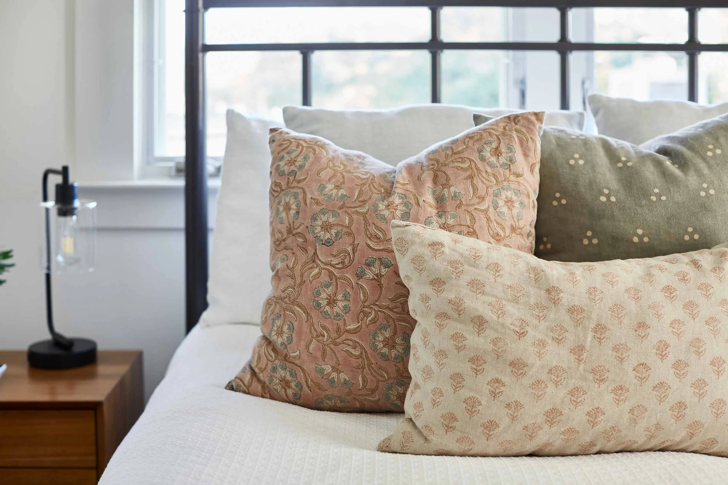 Bright bedroom with colorful textiles, designed by JKB Home Design in Southern California