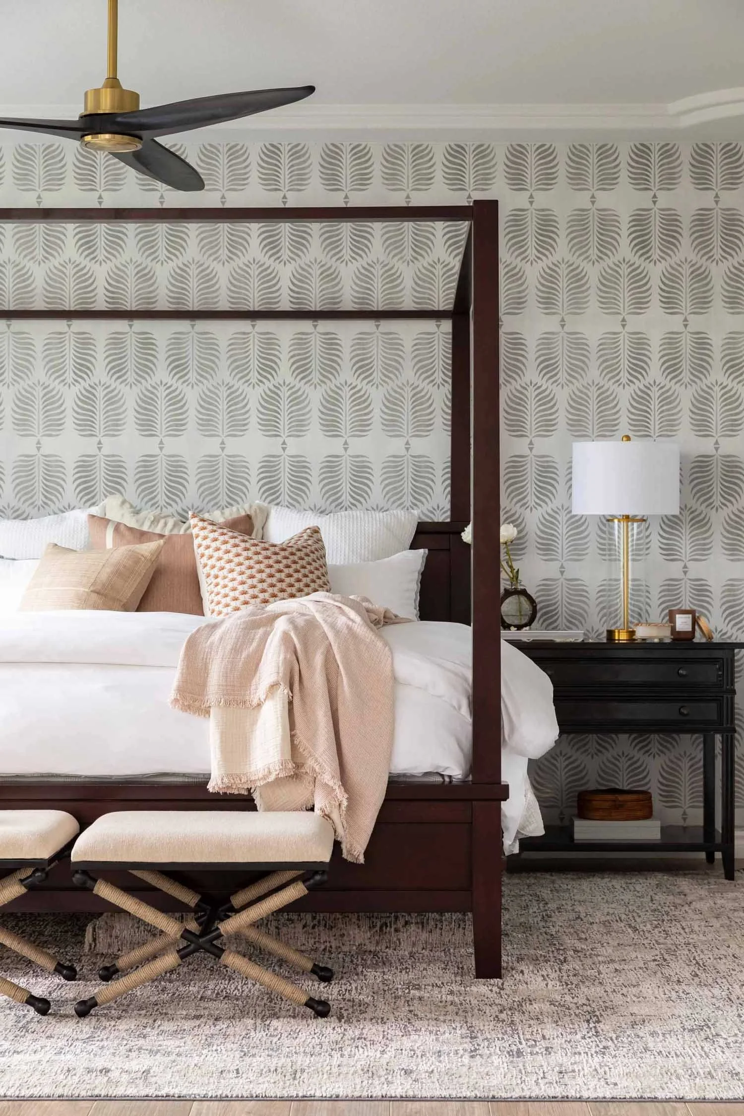Primary bedroom with botanical wallpaper and four-poster bed, designed by JKB Home Design in Southern California