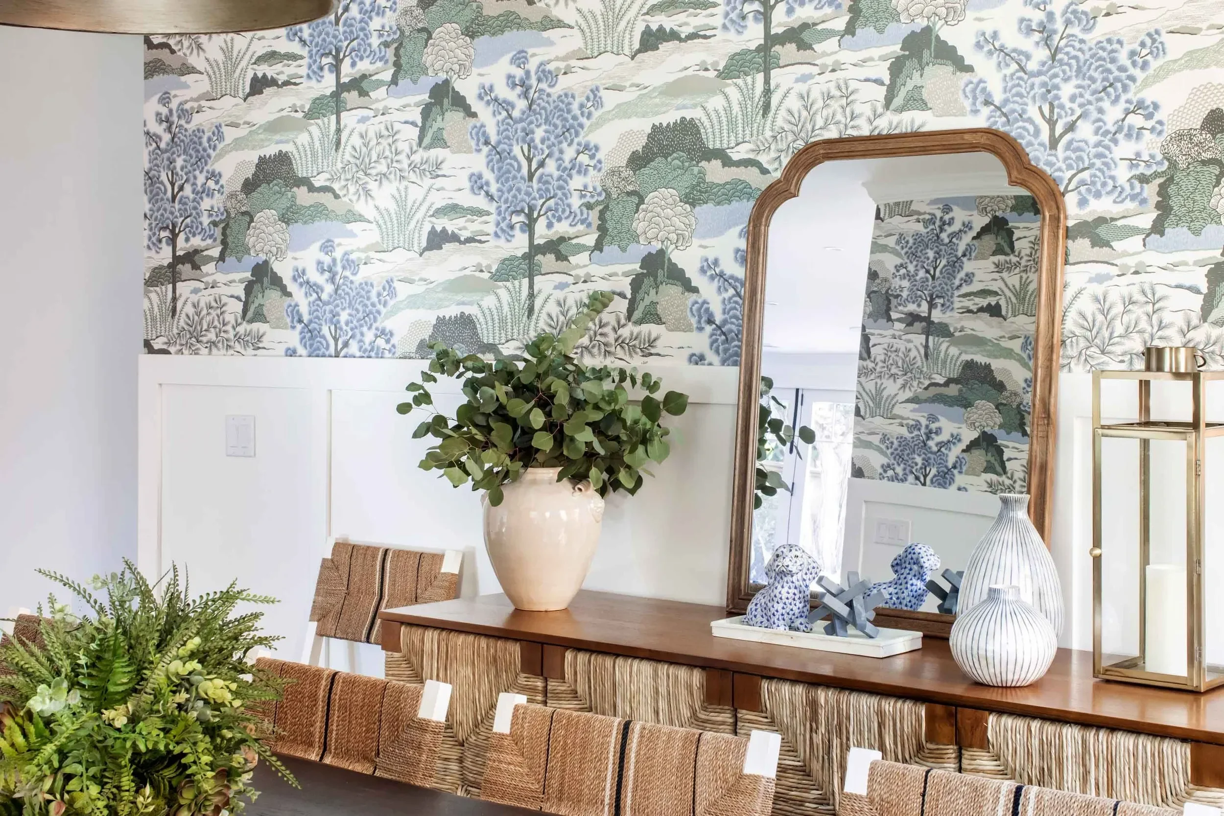 Palos Verdes dining room with patterned wallpaper and rattan chairs, designed by Julie Beuerlein, interior designer