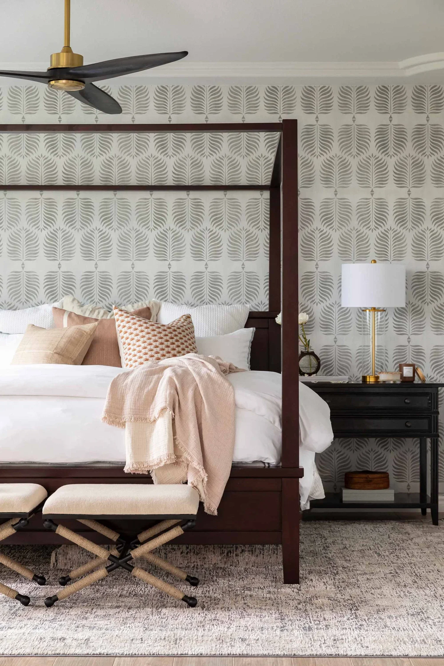 Primary bedroom with botanical wallpaper and four-poster bed, designed by JKB Home Design in Southern California