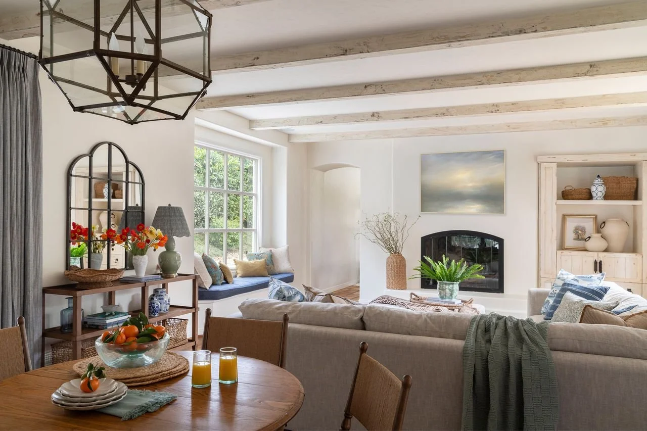 Living room with white fireplace and built-in shelving in a Palos Verdes Estates home, designed by JKB Home Design