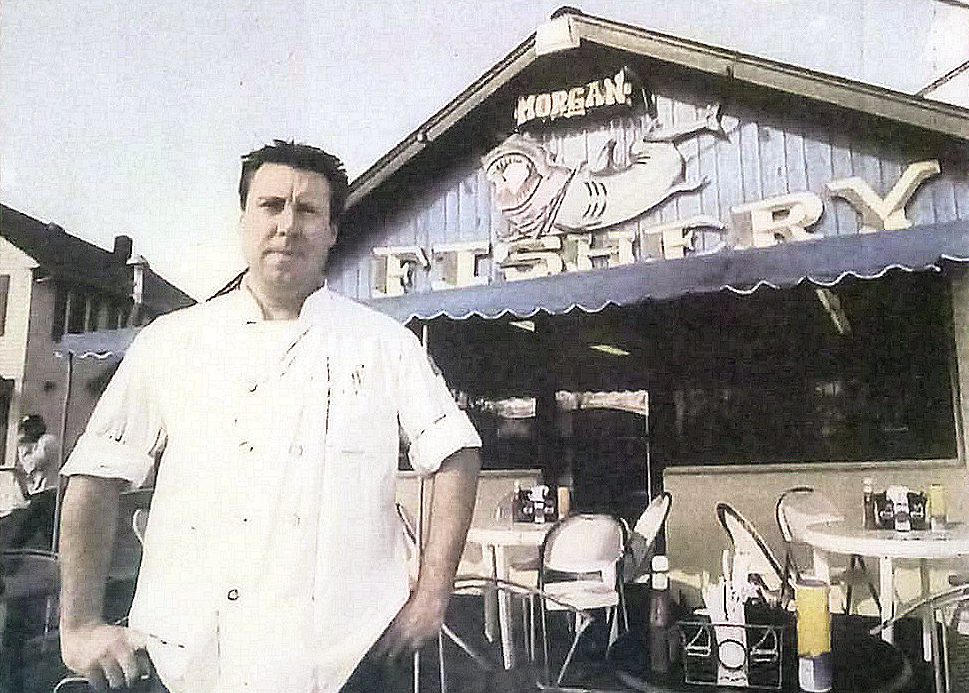 Joey standing outside of his seafood restaurant The Morgan Fishery.