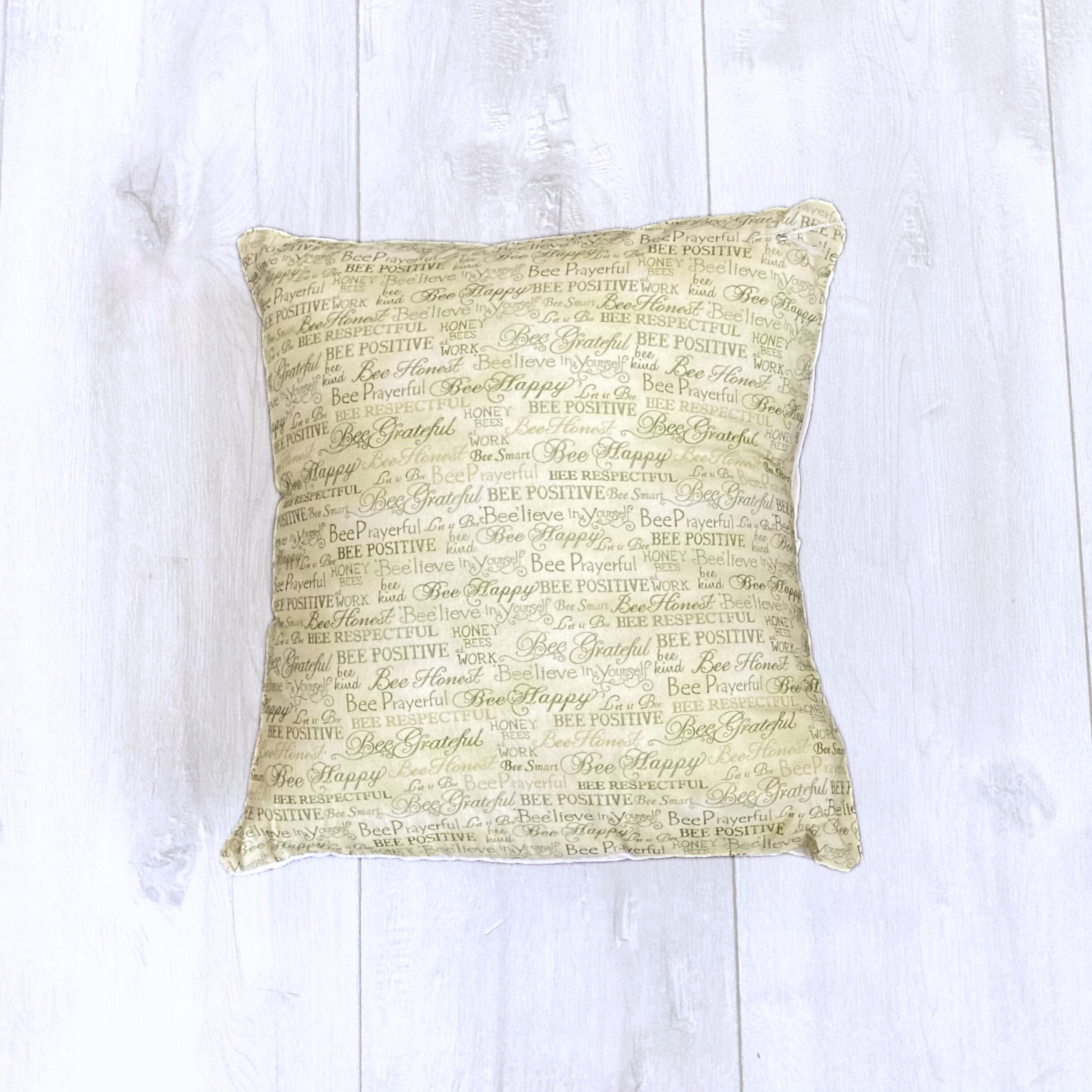 bee positive green pillow.png