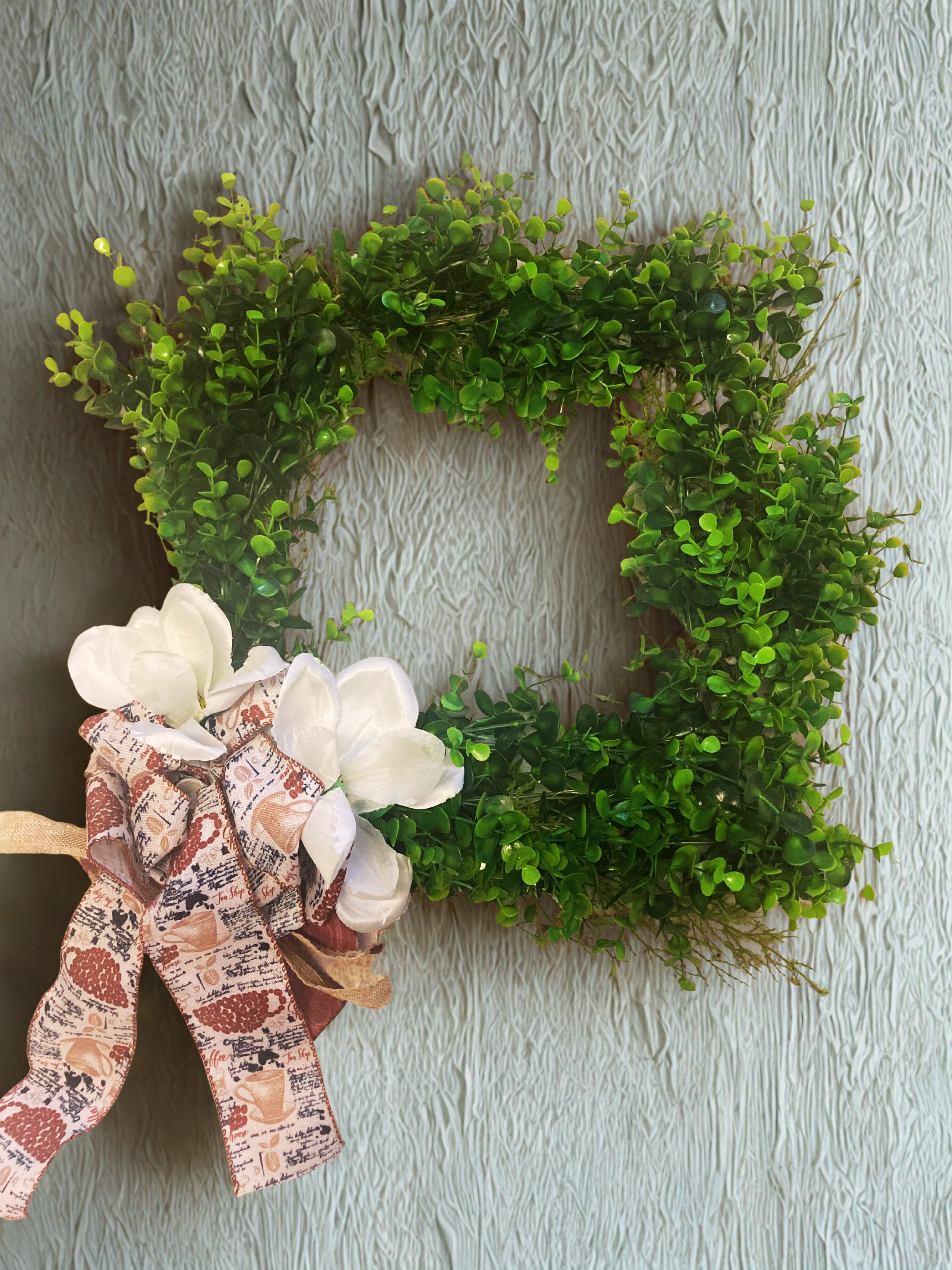 coffee wreath white wall.png